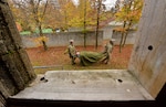 Two soldiers carry a mock wounded soldier on a litter.