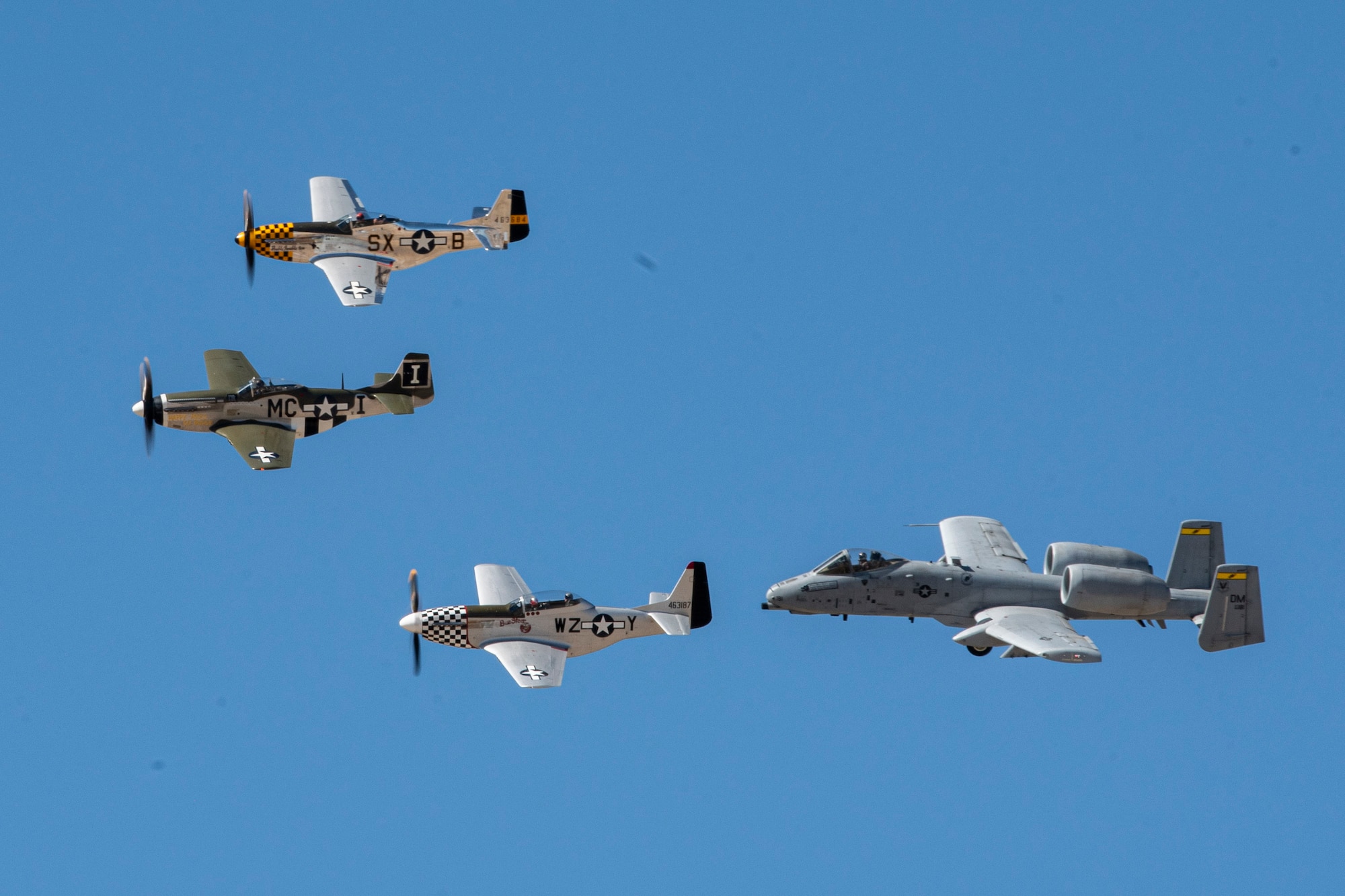 Four planes fly in formation.