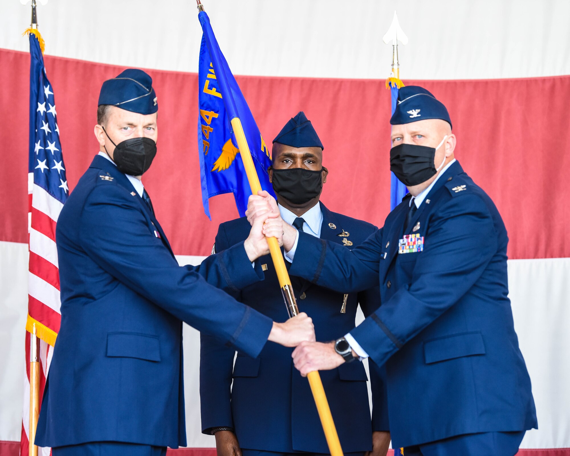 Reserve Citizen Airman Col Karwin Weaver accepts command of the 944th Maintenance Group from the 944th Fighter Wing Commander, Col Mark Van Brunt in an official ceremony on Luke Air Force Base, Ariz., January 29, 2022. The 944th MXG is partnered with the 56th Maintenance Group, referred together as the 1K Maintenance Group and is made up of active-duty and Reserve Citizen Airmen. (U.S. Air Force photo/Tech. Sgt. Nestor Cruz)