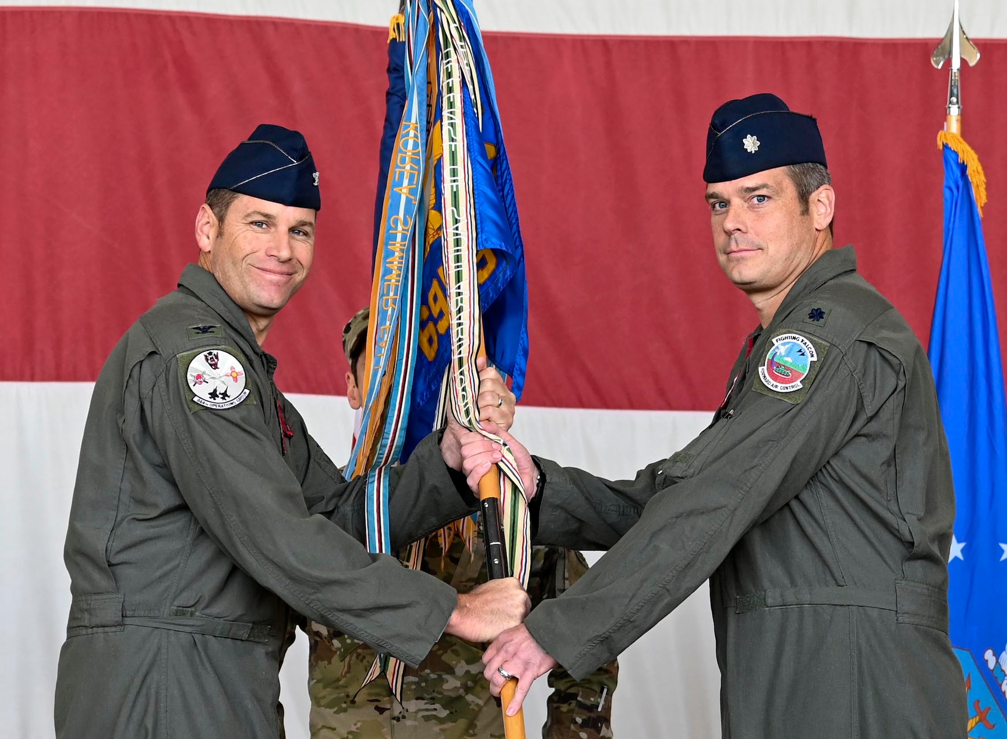 Reserve Citizen Airman Lt Col Aaron Weedman assumes command of the 69th Fighter Squadron during an official ceremony on Luke Air Force Base, Ariz., March 4, 2022. The 69th FS was activated on January 15, 1941 as the 69th Pursuit Group and since have returned to their roots by training the world’s greatest fighter pilots while keeping with their traditions of honor, bravery, and, above all, the adventuring spirit of The Fighting 69th. (U.S. Air Force photo/ Staff Sgt. Matthew Bruch)