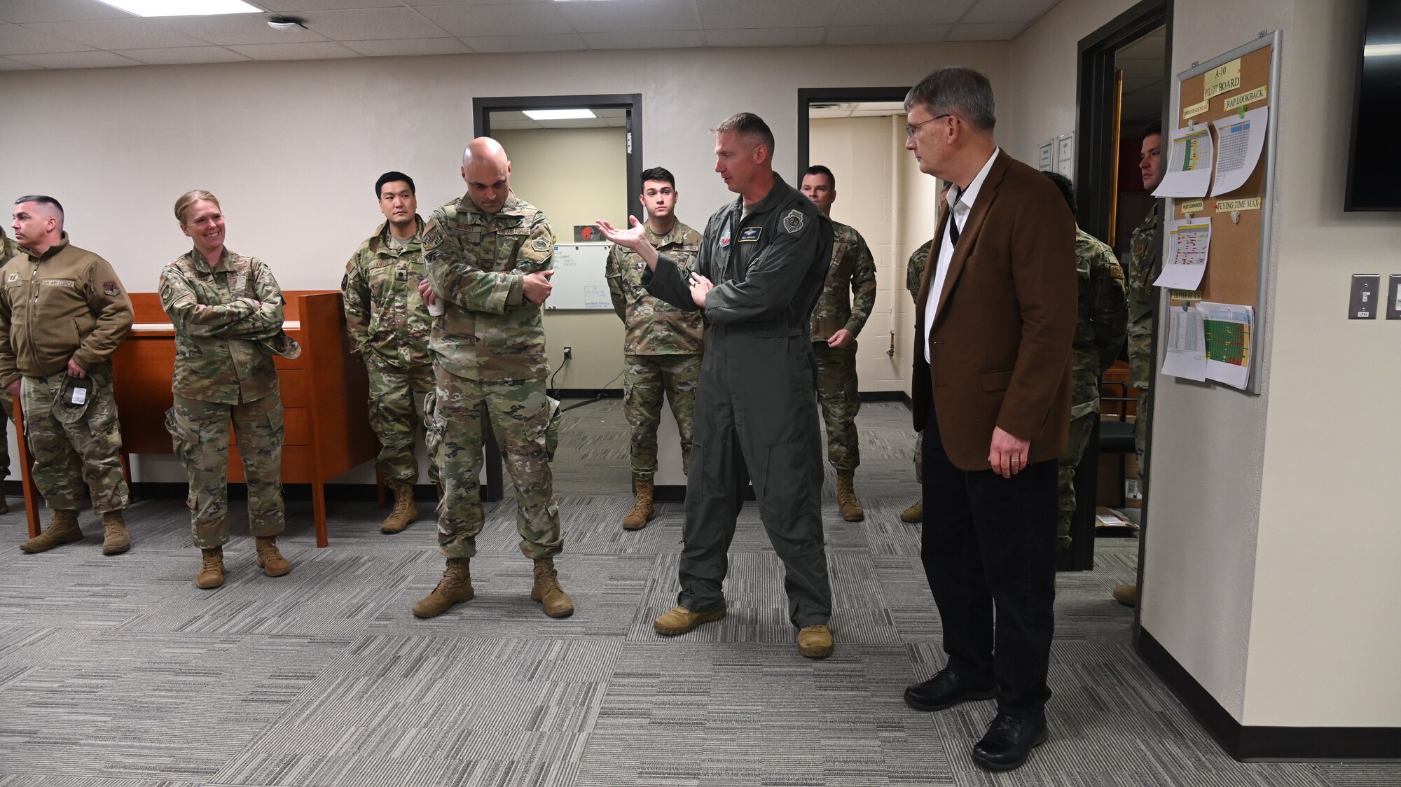 Mr. Devin Cate, right, executive director, Air National Guard, speaks to Airmen with the 175th Operations Group at the 175th Wing, March 5, 2022, during a visit to Warfield Air National Guard Base at Martin State Airport, Middle River, Maryland.  Cate visited many squadrons and groups during his time on base. (U.S. Air National Guard photo by A1C Alexandra Huettner)
