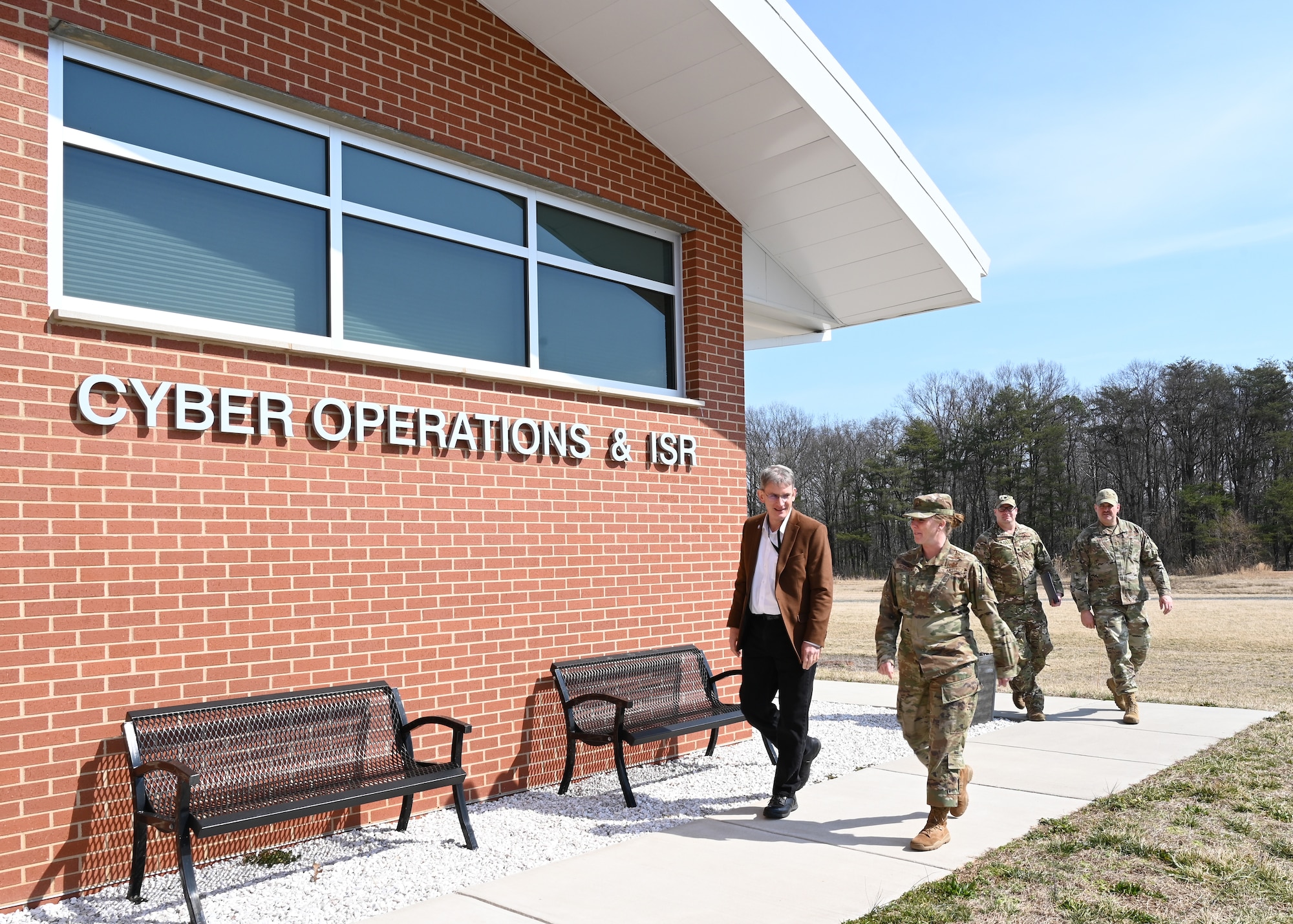 Mr. Devin Cate, (left), executive director, Air National Guard, and U.S. Air Force Brig. Gen. Jori Robinson, right, commander, 175th Wing, tour the 175th Cyberspace Operations facility, March 5, 2022, during a visit to Warfield Air National Guard Base at Martin State Airport, Middle River, Maryland. During the visit, Mr. Cate toured the base and had the opportunity to meet with Airmen and tour the facilities for the maintenance group, mission support group, and the cyberspace operations group. (U.S. Air National Guard photo by Tech. Sgt. Enjoli Saunders)