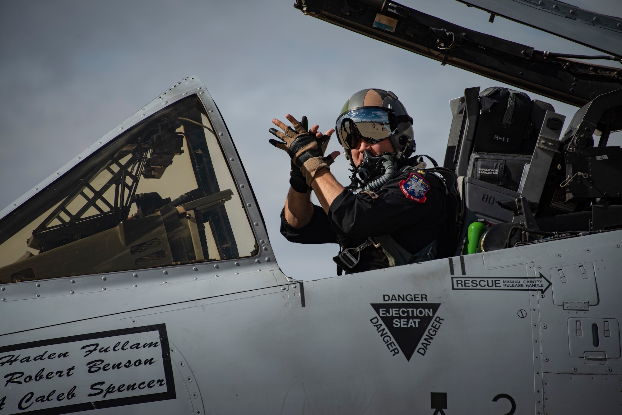 A pilot in the cockpit of a plane.