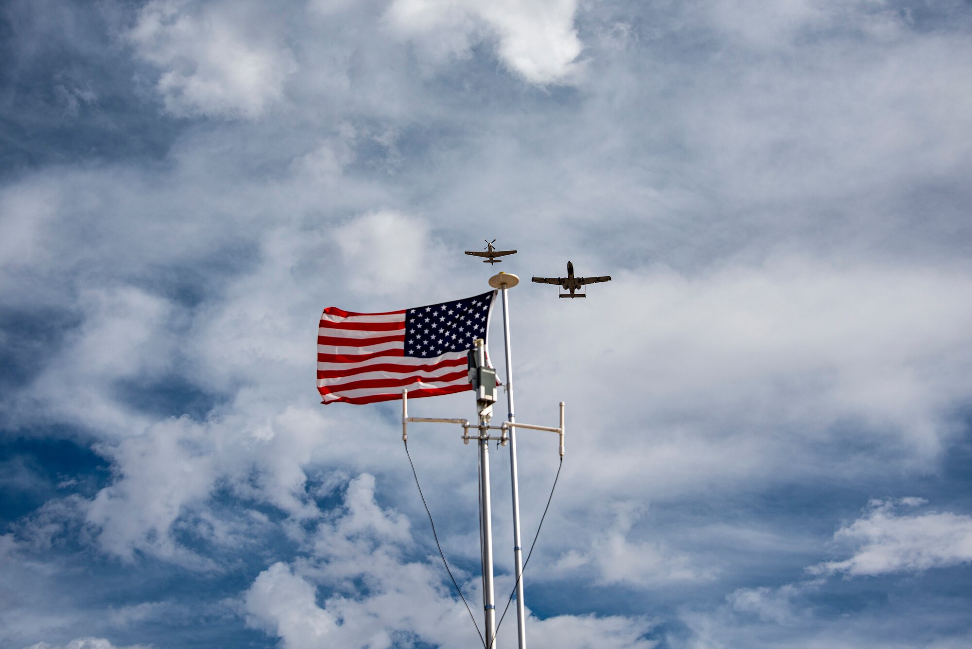 Two planes fly in formation.