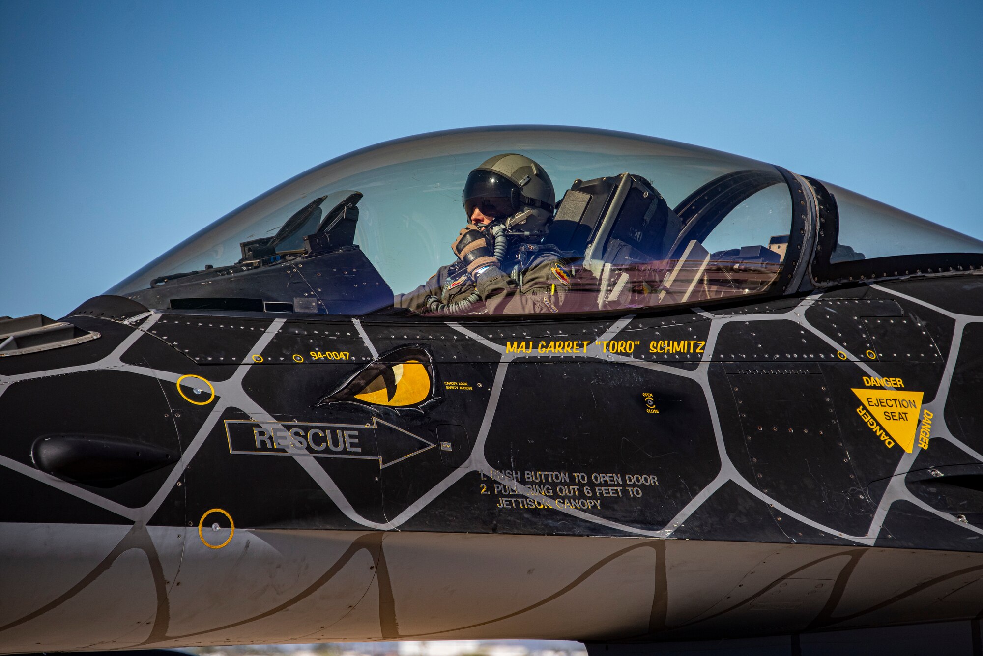 An Airmen in a plane's cockpit.