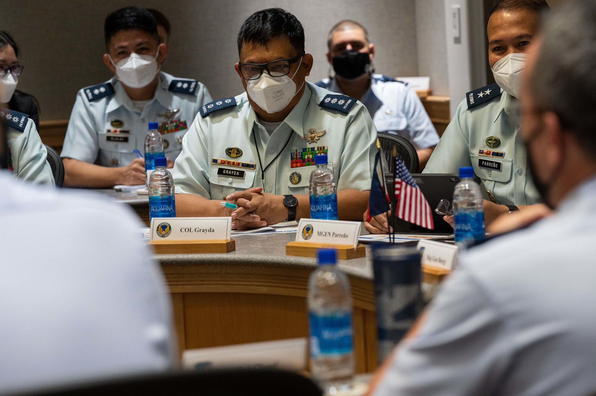 Philippine Air Force Col. Jose Johnson T. Grayda, Assistant Chief of Air Staff for Education and Training, listens as U.S. Air Force airmen introduce themselves during the 10th Airman-to-Airman Talks between the two air forces, Joint Base Pearl Harbor-Hickam, Hawaii, Feb. 15, 2022. There were three objectives during this iteration of the Airman-to-Airman Talks: review the effectiveness of all engagements, refine engagement priorities over the next several years, and strengthen the interoperability between the two air forces. (U.S. Air Force photo by Tech. Sgt. Hailey Haux)