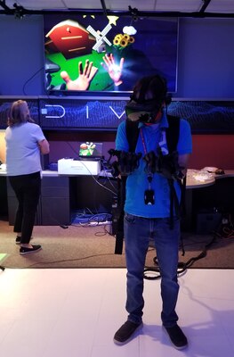 Team members at the U.S. Army Engineer Research and Development Center’s Information Technology Laboratory test a new set of virtual reality gloves, which allow users to grab and manipulate items within a simulated environment. The gloves are just one step in expanding the augmented and virtual reality research and development capabilities of the lab.