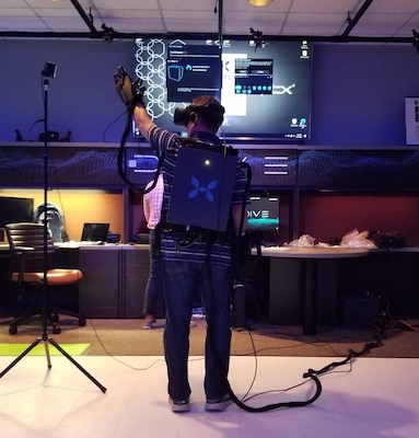 Team members at the U.S. Army Engineer Research and Development Center’s Information Technology Laboratory test a new set of virtual reality gloves, which allow users to grab and manipulate items within a simulated environment. The gloves are just one step in expanding the augmented and virtual reality research and development capabilities of the lab.