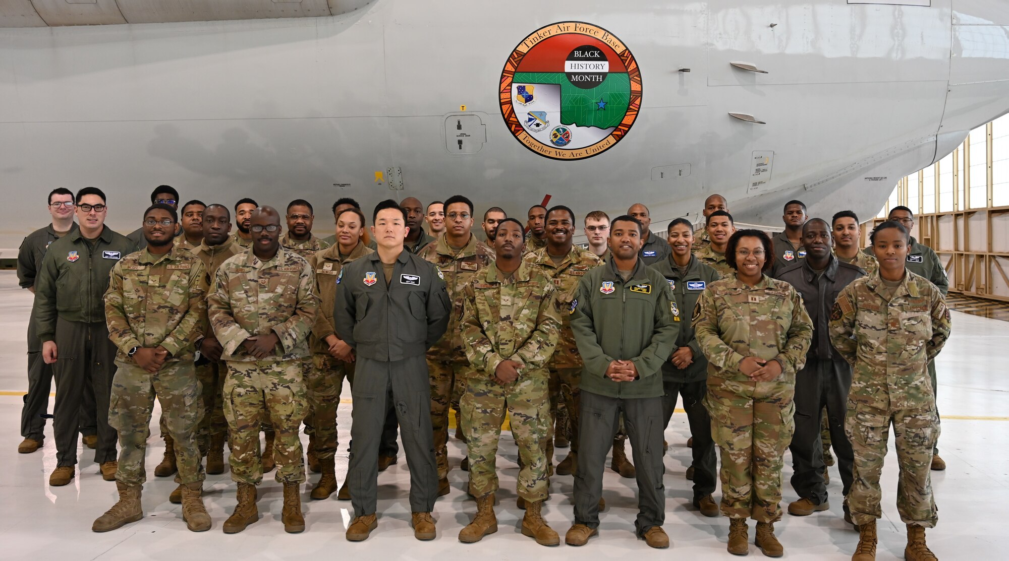 group photo in front of the E-3 jet