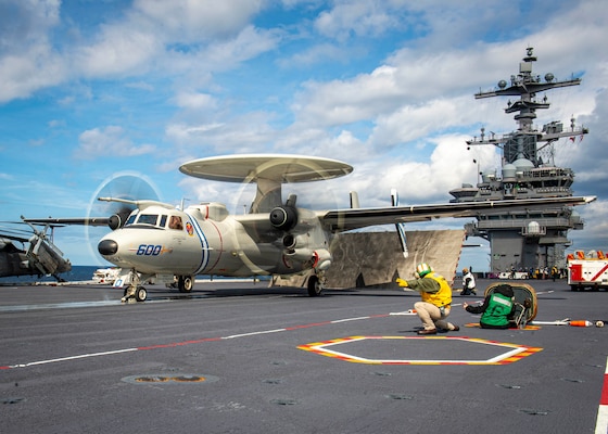 An E-2D Hawkeye aircraft, attached to Carrier Airborne Early Warning Squadron (VAW-121), launches from the flight deck of USS George H.W. Bush (CVN 77) during Tailored Ship's Training Availability/Final Evaluation Problem (TSTA/FEP)