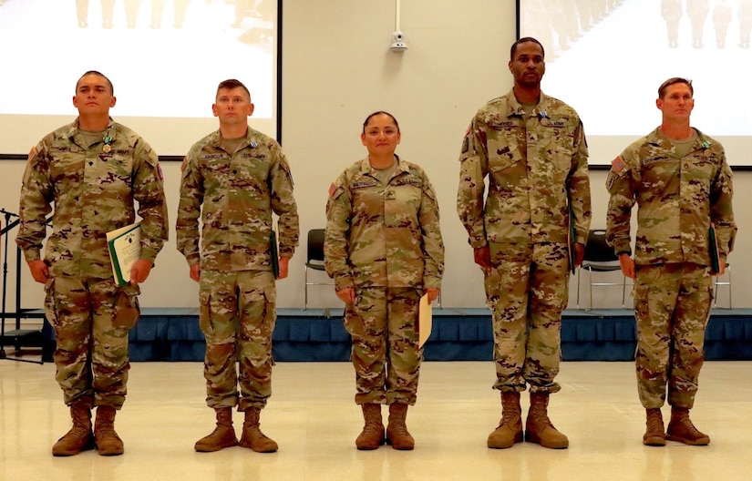 9th MSC Competitors present themselves at the Best Warrior Competition Ceremony at Bongo Hall, Fort Shafter Flats March 7, 2022. From left to right: Spc. Shawbaz Soaia, 100th Battalion; Spc. Charles Johnson, 303rd Maneuver Enhancement Brigade; Sgt. Gloria Maldonado, 658th Regional Support Command; Sgt. Steven Jones, 411th Engineer Battalion; and Staff Sgt. Jeremy Dornbusch, 100th Battalion. (Photo by U.S. Army Sgt. 1st Class Edwin Basa, 305th MPAD)