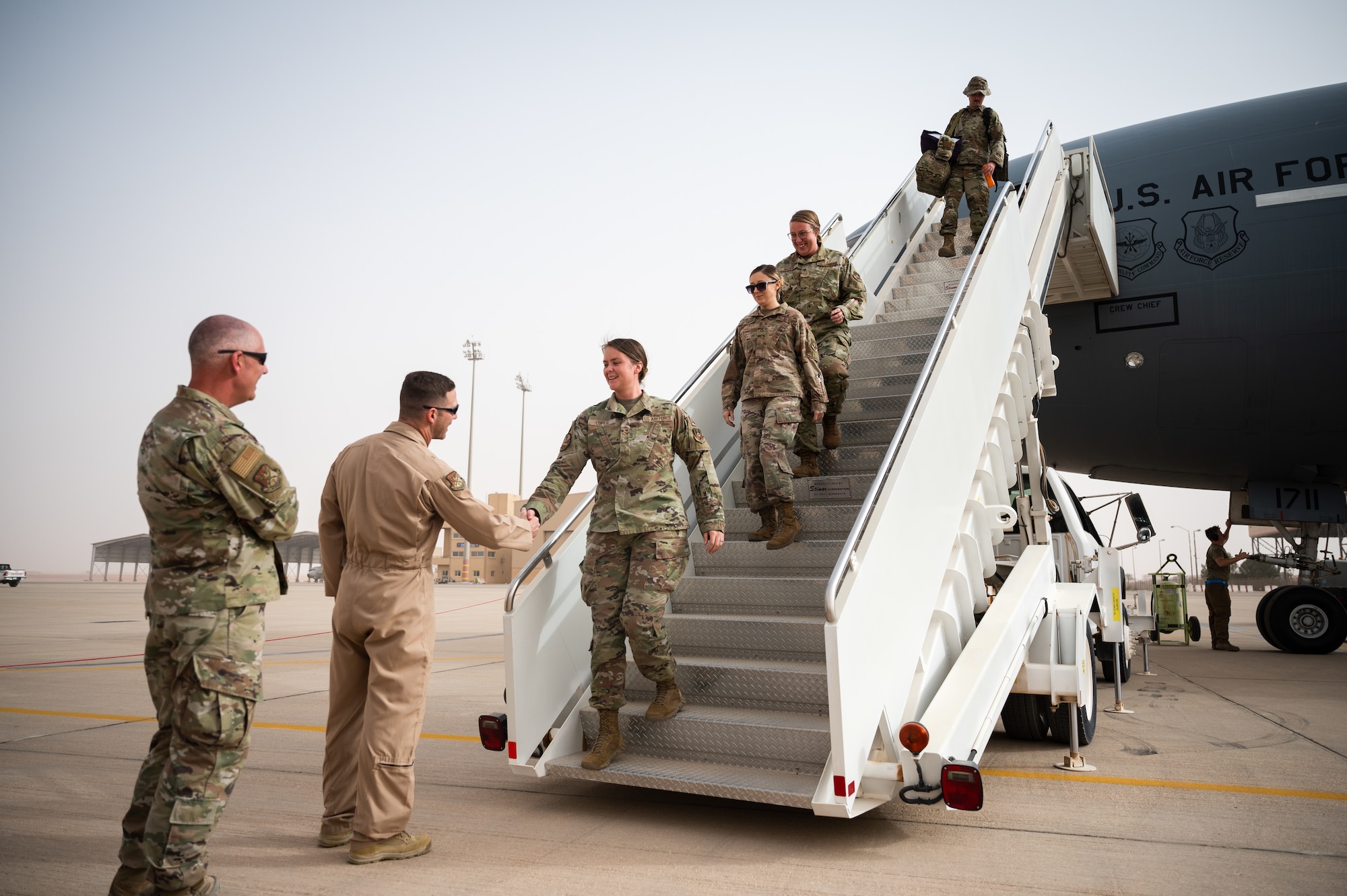 U.S. Air Force Brig. Gen. Robert Davis, 378th Air Expeditionary Wing commander, greets Airmen from the 908th Expeditionary Air Refueling Squadron at Prince Sultan Air Base, Kingdom of Saudi Arabia, March 6, 2022. Previously operating out of Al Dhafra Air Base, United Arab Emirates, the 908th EARS relocated to PSAB. (U.S. Air Force photo by Senior Airman Jacob B. Wrightsman)