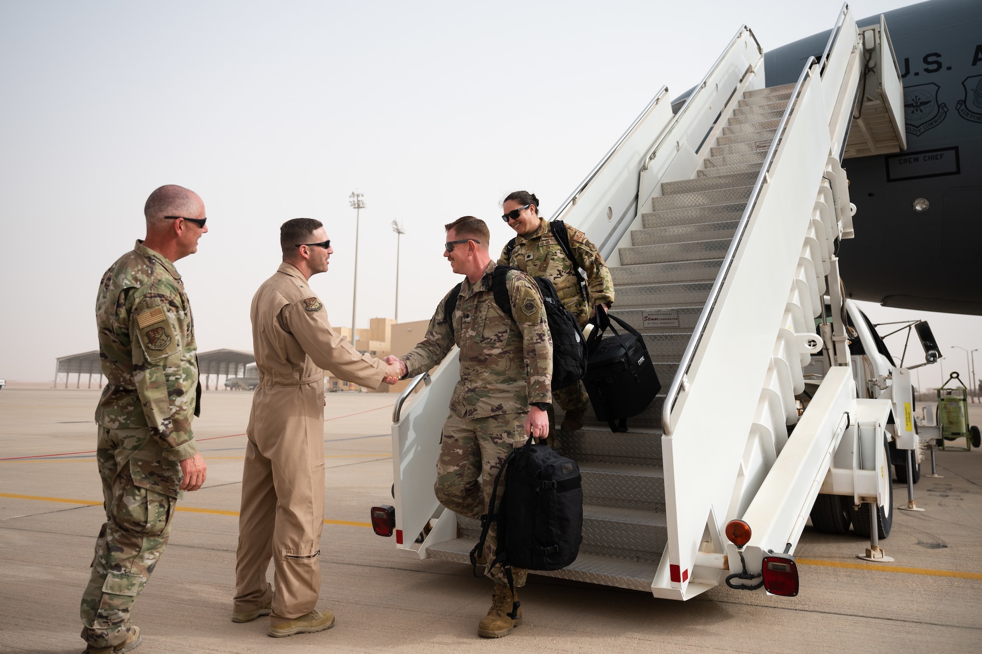 U.S. Air Force Brig. Gen. Robert Davis, 378th Air Expeditionary Wing commander, greets Airmen at Prince Sultan Air Base, Kingdom of Saudi Arabia, March 6, 2022. Previously stationed at Al Dhafra Air Base, United Arab Emirates, the 380th Expeditionary Aircraft Maintenance Squadron and 908th Expeditionary Air Refueling Squadron will now operate out of PSAB. (U.S. Air Force photo by Senior Airman Jacob B. Wrightsman)