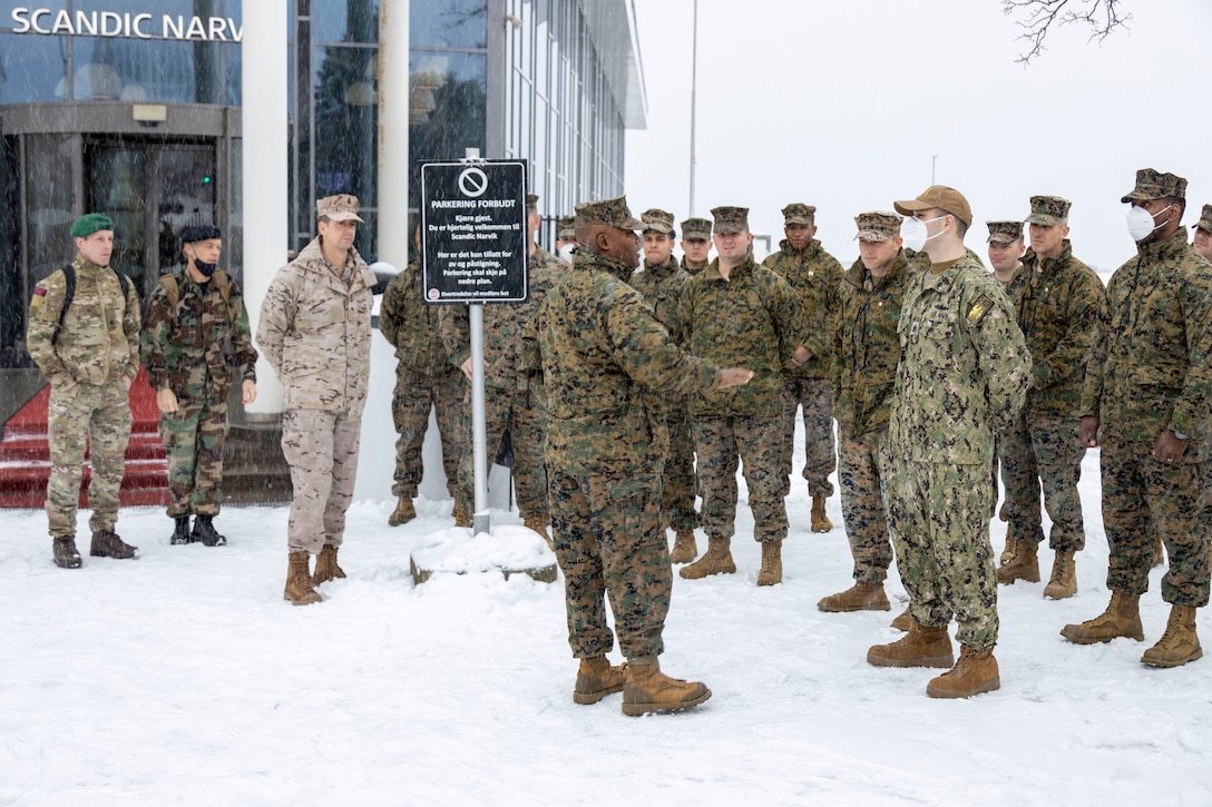 U.S. Marines with 2d Marine Expeditionary Brigade and other NATO members prepare to board the Italian Marine Militare ship, Garibaldi, in preparation for Exercise Cold Response 2022, Narvik, Norway, March 7, 2022. Exercise Cold Response '22 is a biennial Norwegian national readiness and defense exercise that takes place across Norway, with participation from each of its military services, as well as from 26 additional North Atlantic Treaty Organization allied nations and regional partners. (U.S. Marine Corps Photo by Staff Sgt. Shawn Coover)