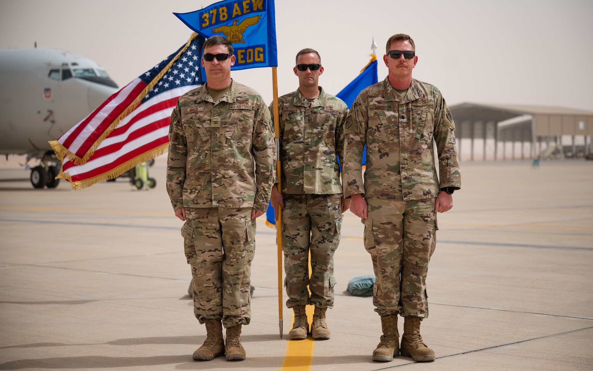 U.S. Air Force Col. Benjamin Busch, 378th Expeditionary Operations Group commander, and U.S. Air Force Lt. Col. Jason Purcell, incoming 378th Expeditionary Aircraft Maintenance Squadron commander, stand at the position of attention during the 378th AMXS unit activation ceremony at Prince Sultan Air Base, Kingdom of Saudi Arabia, March 7, 2022. Formerly the 380th Expeditionary Aircraft Maintenance Squadron of Al Dhafra Air Base, United Arab Emirates, the unit along with it’s U.S. Air Force KC-10 Extenders and E-3 Sentries relocated permanently to PSAB. (U.S. Air Force photo by Senior Airman Jacob B. Wrightsman)