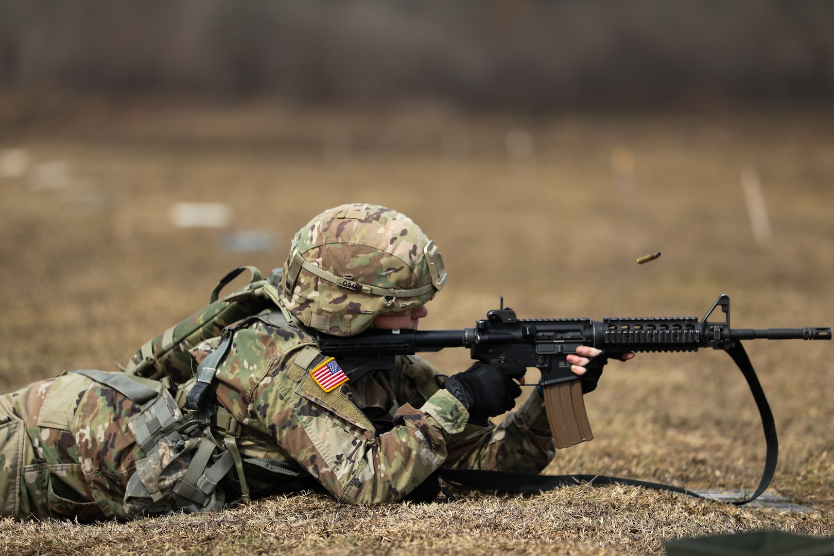 An Oklahoma Army National Guard Soldier shoots targets during a weapons skills challenge at the Best Warrior Competition at Camp Gruber Training Center, Oklahoma, March 4, 2022. Soldiers tested their proficiency in a variety of warrior tasks and drills during the annual three-day event.