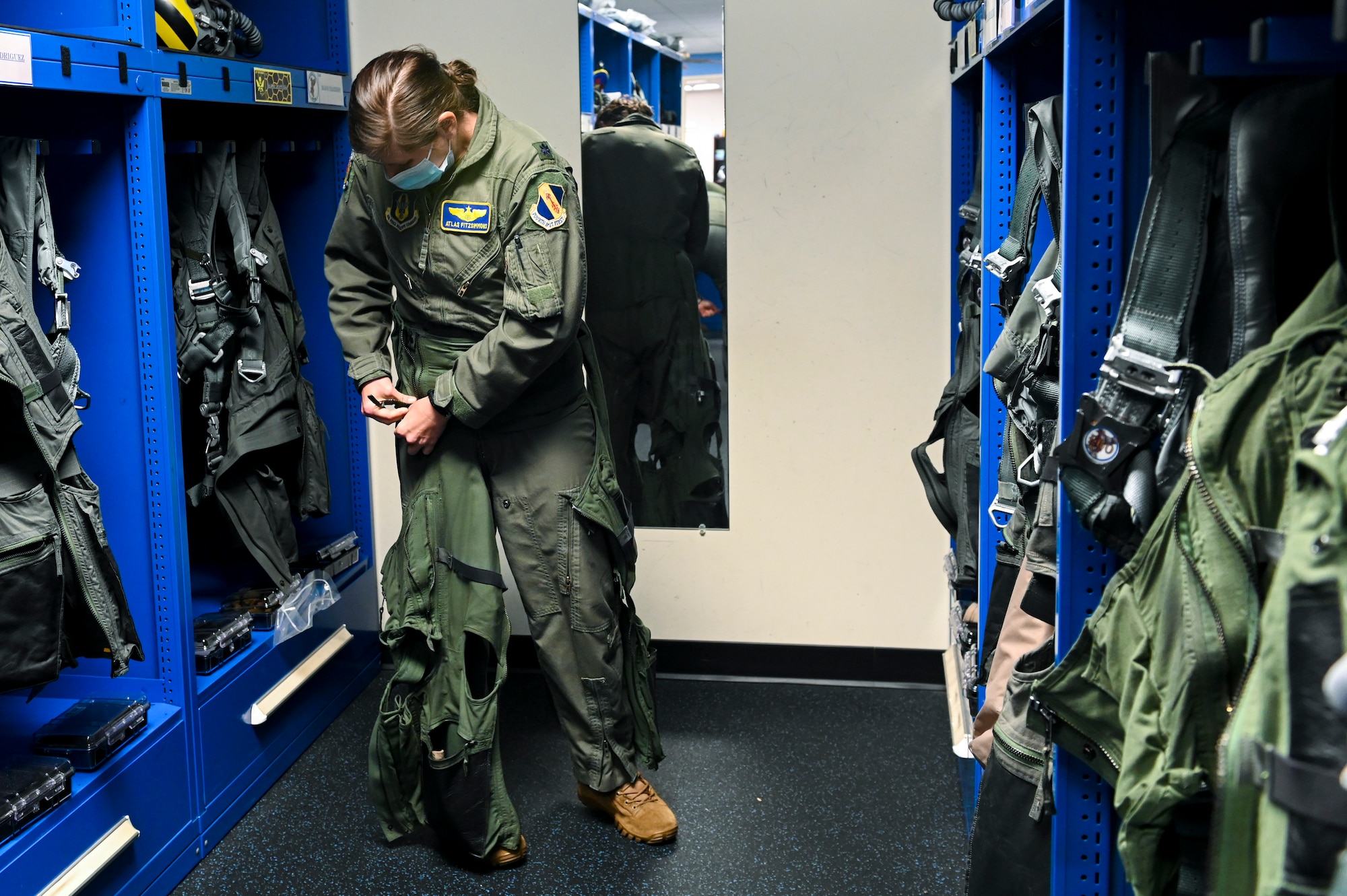 Lt. Col. Bridgett “Atlas” Fitzsimmons, 334th Fighter Squadron director of operations, suits up before a flight at Seymour Johnson Air Force Base, North Carolina, Jan. 5, 2022.