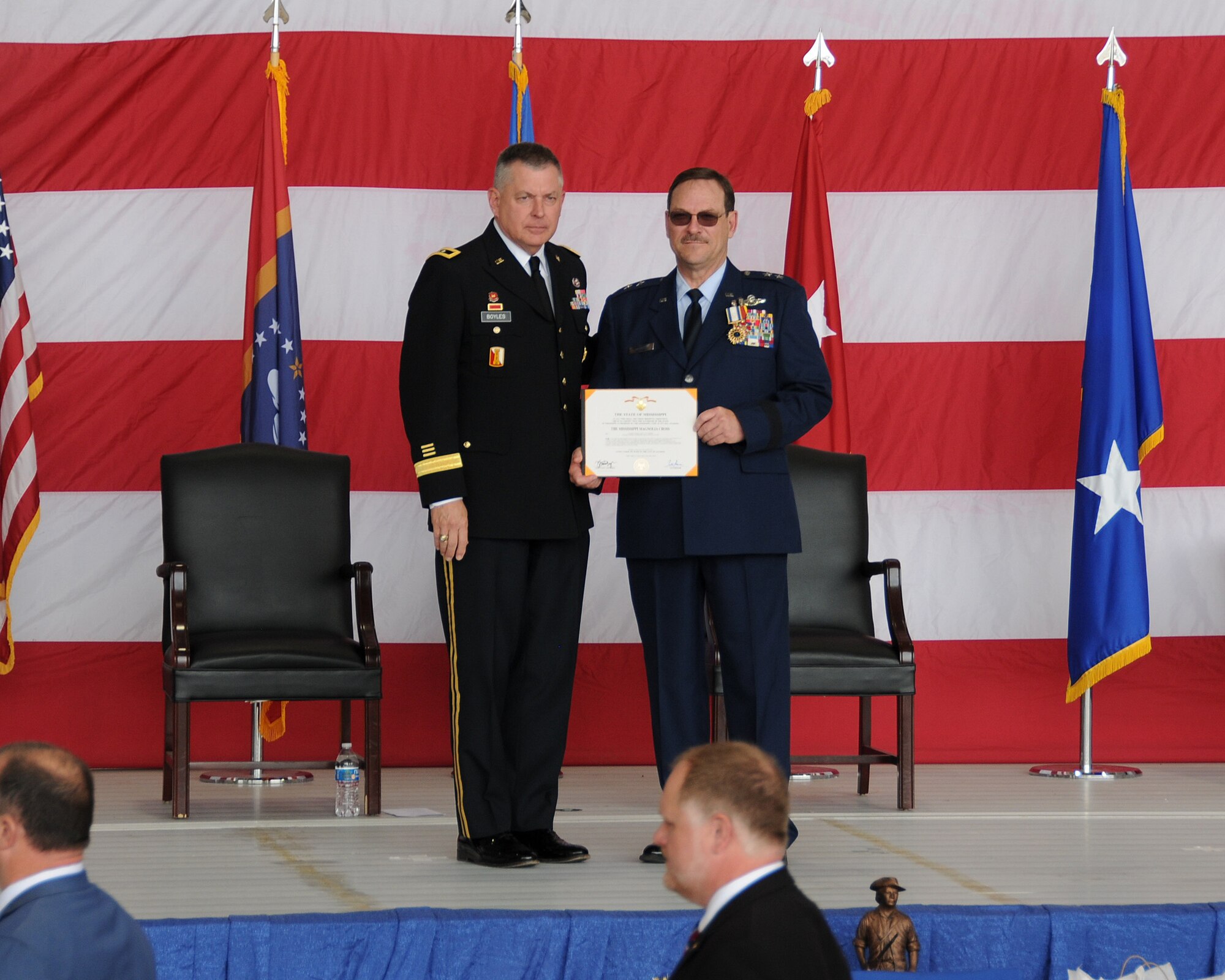 Maj. Gen. Janson D. Boyles, the Adjutant General of Mississippi,  presents the Mississippi Magnolia Cross to Maj. Gen. Billy M. Nabors, former  Assistant Adjutant General and Commander, Mississippi Air National Guard, during Nabors’ retirement ceremony, March 6, 2022, at Key Field Air National Guard  Base, Meridian , Mississippi.