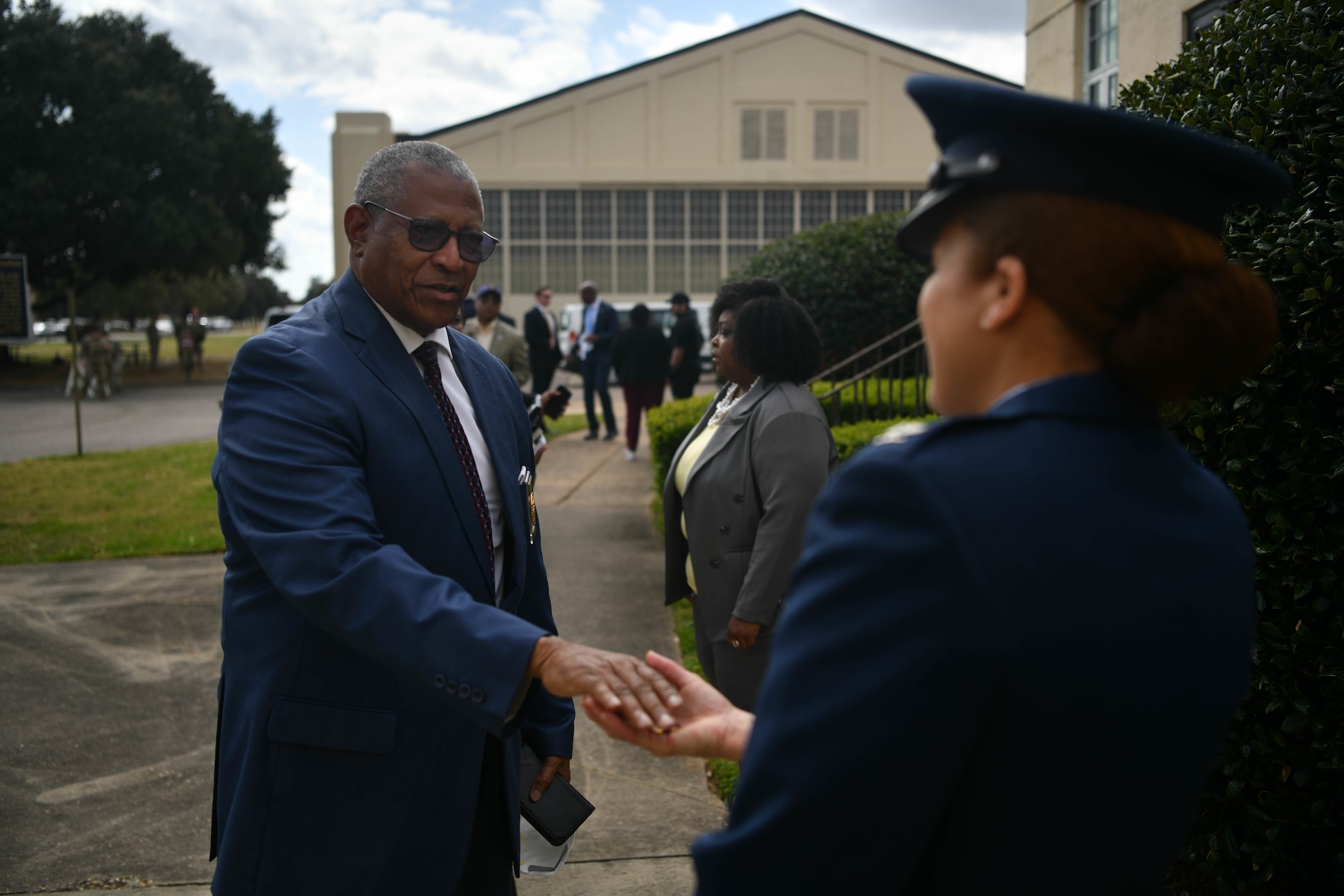 Col. Eries Mentzer, 42nd Air Base Wing commander, greets Mayor James Perkins, Mayor of Selma, on Maxwell Air Force Base, Alabama March 6, 2022. Vice President Kamala Harris visited Selma to commemorate the 57th anniversary of Bloody Sunday, a civil rights march that turned to tragedy. (U.S. Air Force photo by Senior Airman Jackson Manske)