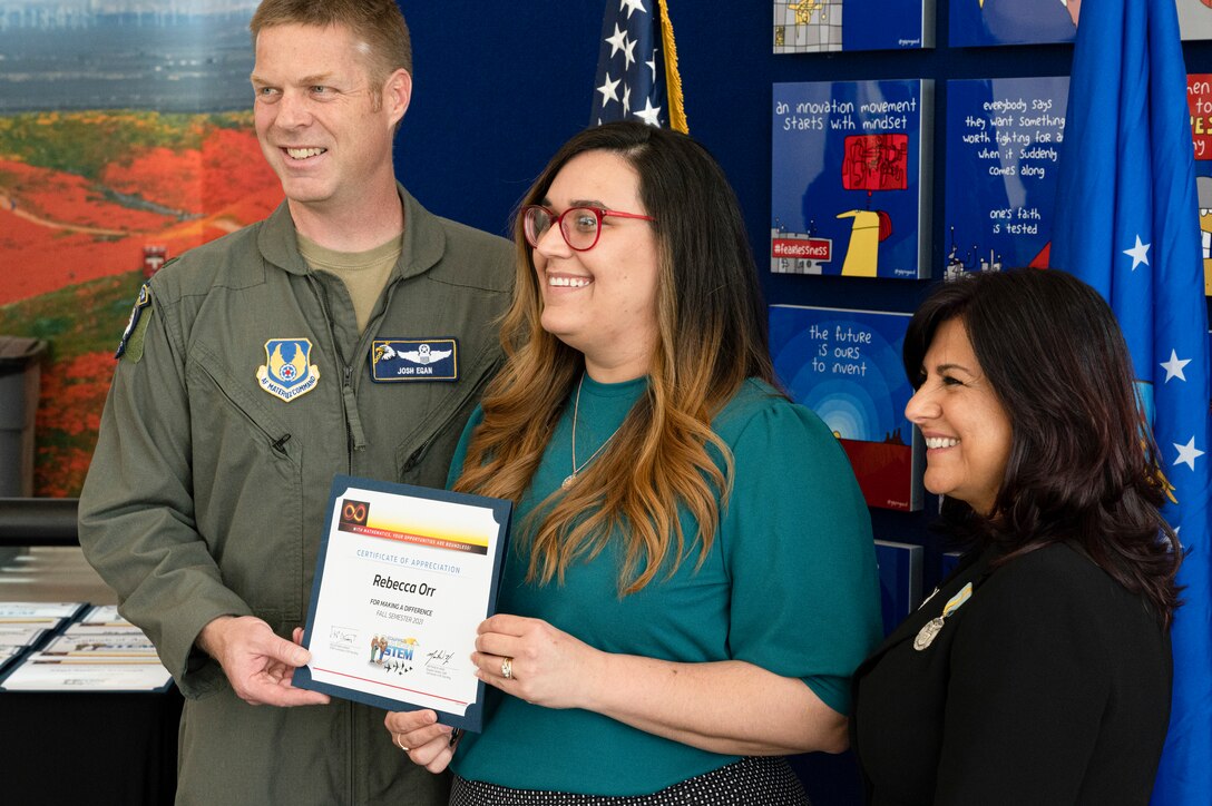 This year 53 STEM volunteers were invited. Col. Joshua Egan, Chief of Safety and Helida Vanhoy, STEM Coordinator awards the recipients with certificates.