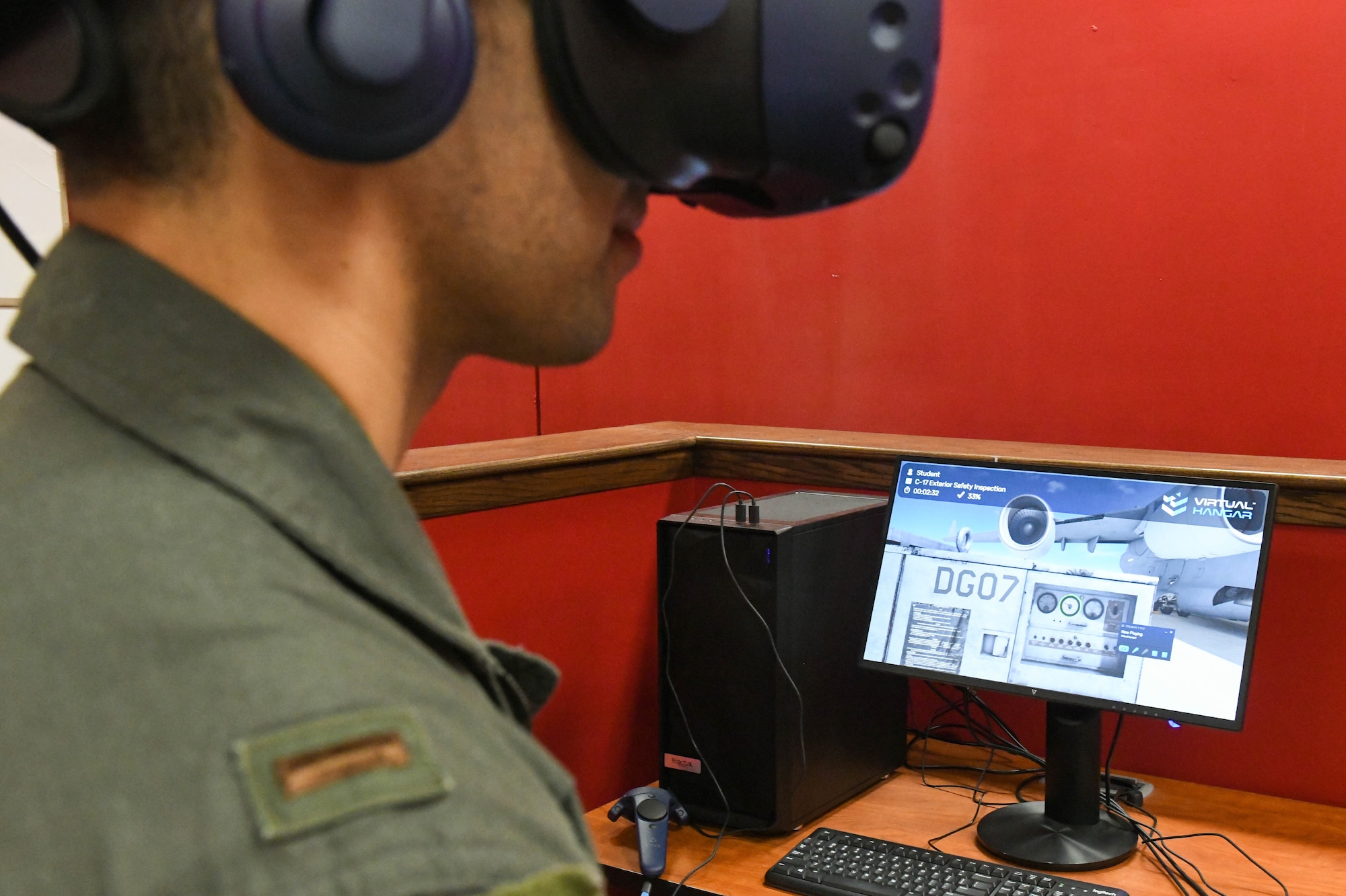 U.S. Air Force 2nd Lt. Prem Wells, 97th Training Squadron C-17 Globemaster III upgrade student, performs an exterior aircraft inspection on a C-17 virtual reality simulator at Altus Air Force Base, Oklahoma, March 3, 2022. The 97th Operations Group is changing the way the 97th AMW trains C-17 Globemaster III, KC-46 Pegasus and KC-135 Stratotanker aircrew members through the 97 AMW innovation center. (U.S. Air Force photo by Airman 1st Class Trenton Jancze)