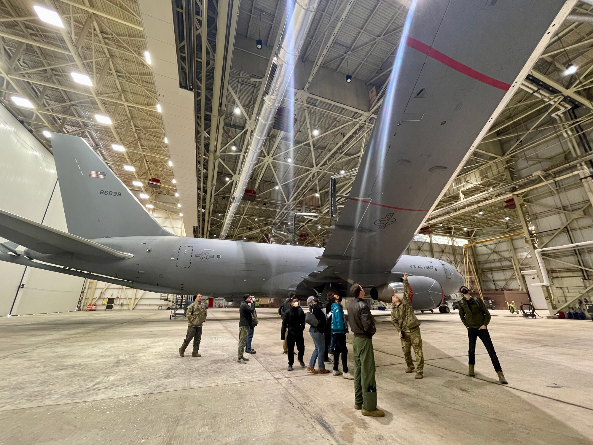 Members of the Specular Theory team tour the outside of a KC-46 Pegasus at Altus Air Force Base, Oklahoma, Feb. 8, 2022. Specular Theory is an official partner with the U.S. Air Force, through AFWERX, and produces immersive training technology for C-17 Globemaster III and KC-135 Stratotanker aircrew members. (Courtesy photo Ryan Pulliam)