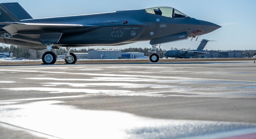 A jet sits on a runway.