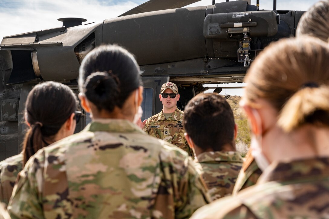 Flight paramedic Sgt. 1st Class Jason Hinrichs, Charlie Company, 2916th Aviation Battalion, 916th Support Brigade, conducts medevac training with Airmen from the 412th Medical Group at Edwards Air Force Base, California, March 3.  (Air Force photo by Katherine Franco)
