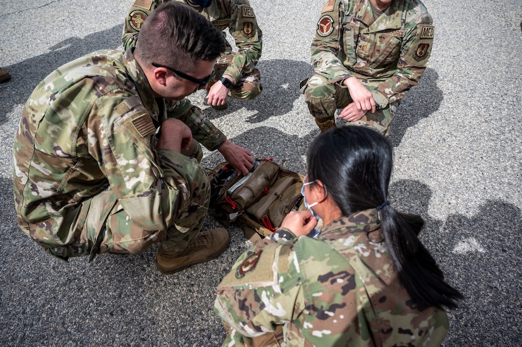Soldiers from C Comapny, 2916th Aviation Battalion, 916th Support Brigade and Airmen from the 412th Medical Group, conduct medevac training at Edwards Air Force Base, California, March 3. (Air Force photo by Katherine Franco)