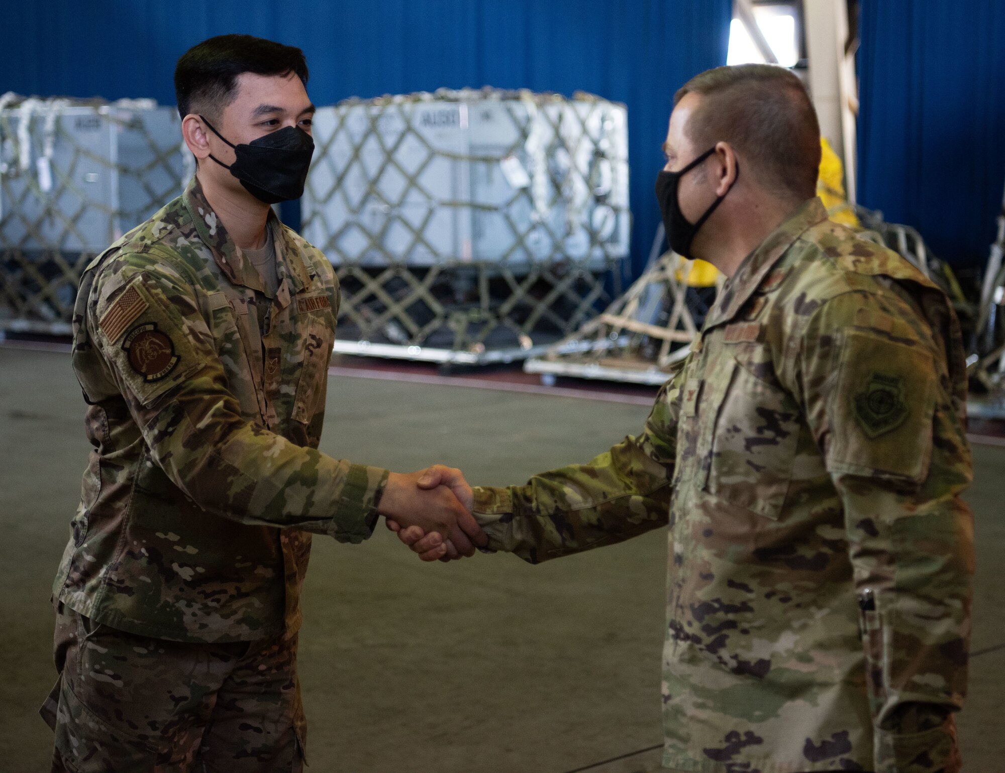 A military member accepts an award.