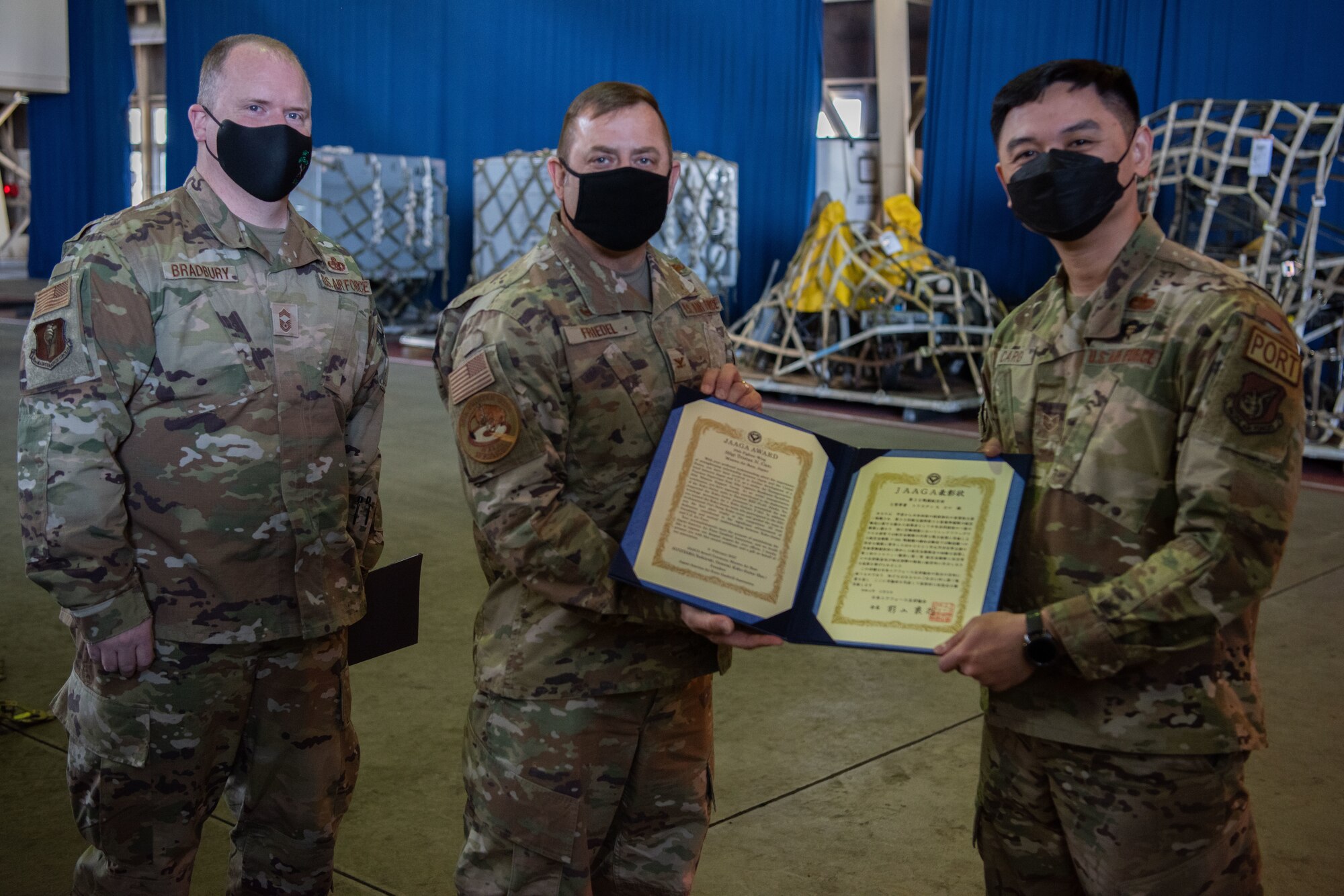 A military member accepts an award.