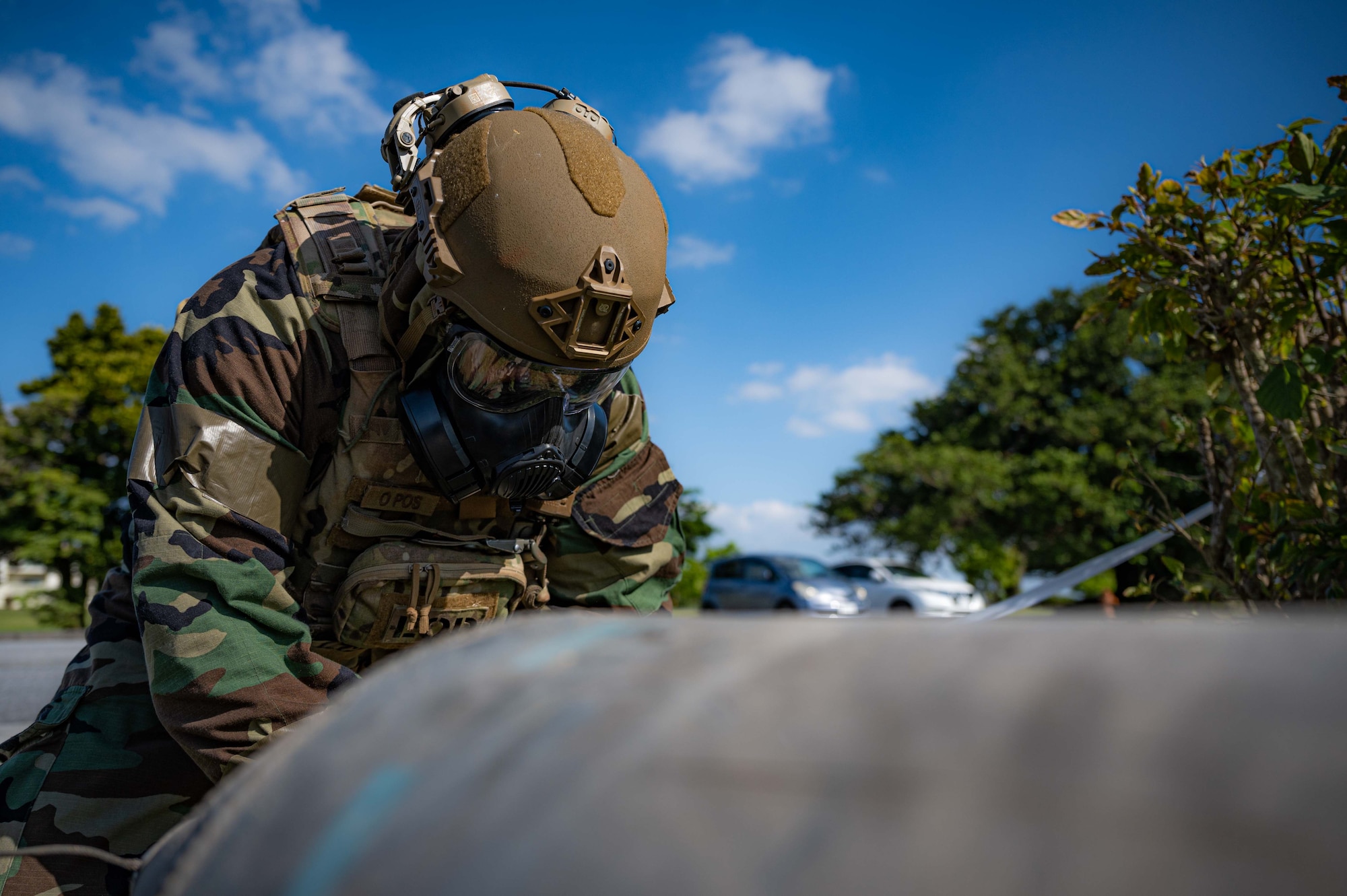 Airman Examines bomb.