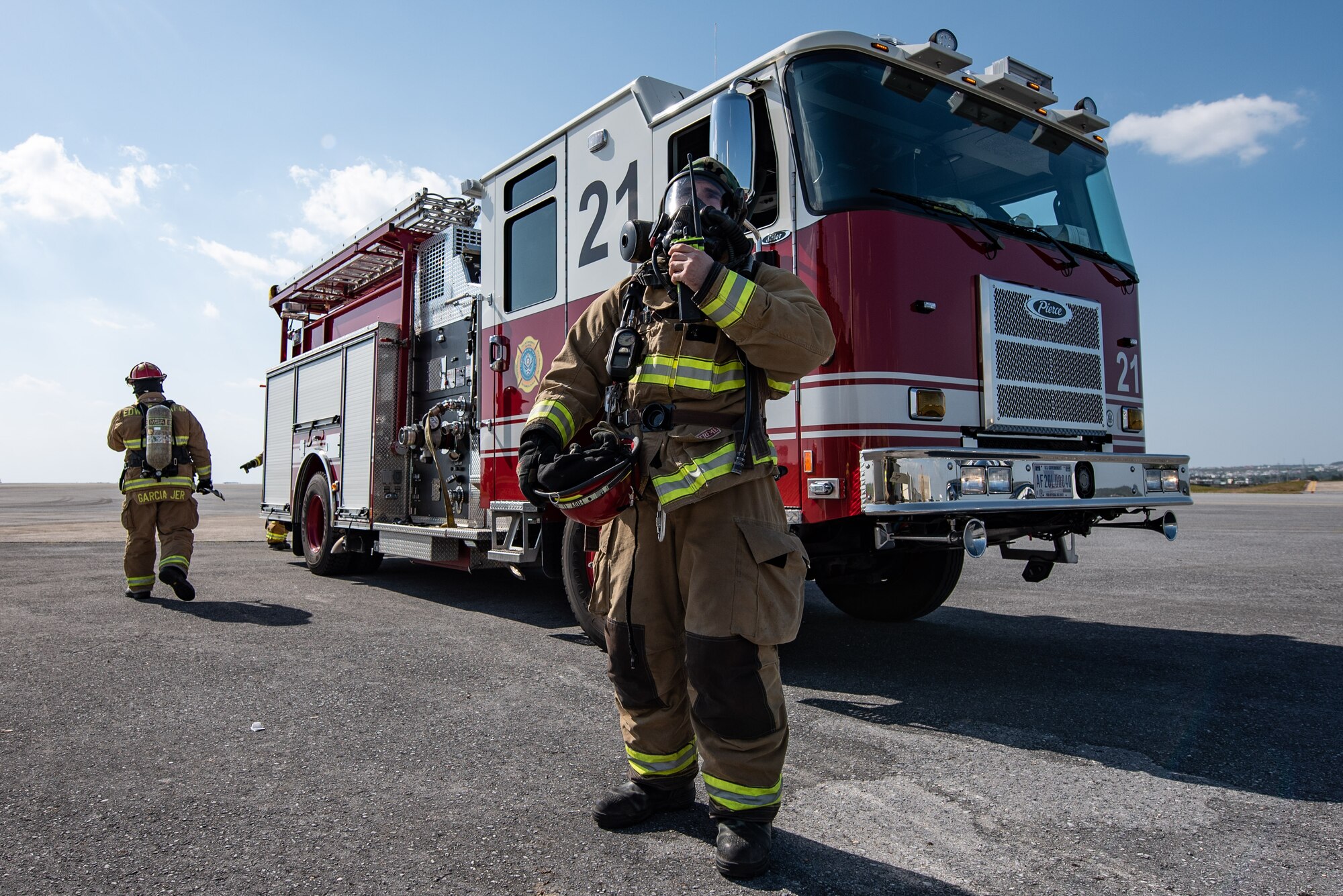 Firefighter uses a radio.