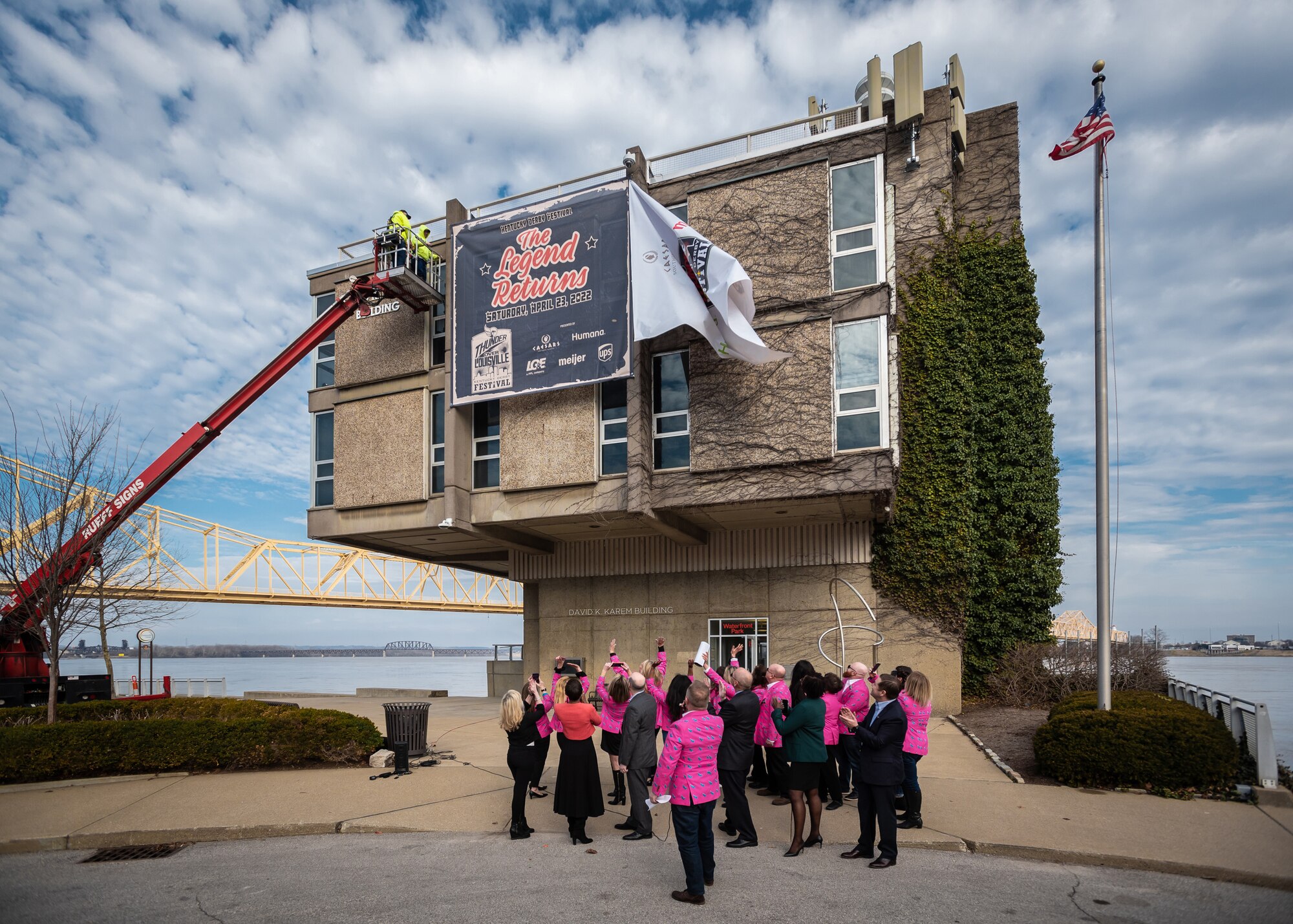 Members of the Kentucky Derby Festival unveil a banner promoting the 2022 Thunder Over Louisville air show and fireworks display during a press conference held along the Ohio River in downtown Louisville, Ky., March 3, 2022. Thunder will return to the waterfront April 23 after a two-year absence and is expected to feature dozens of aircraft, including the U.S. Air Force F-22 Raptor Demo Team and a brand-new C-130J Super Hercules from the Kentucky Air National Guard. This year’s event celebrates the 75th anniversary of the United States Air Force. (U.S. Air National Guard photo by Dale Greer)