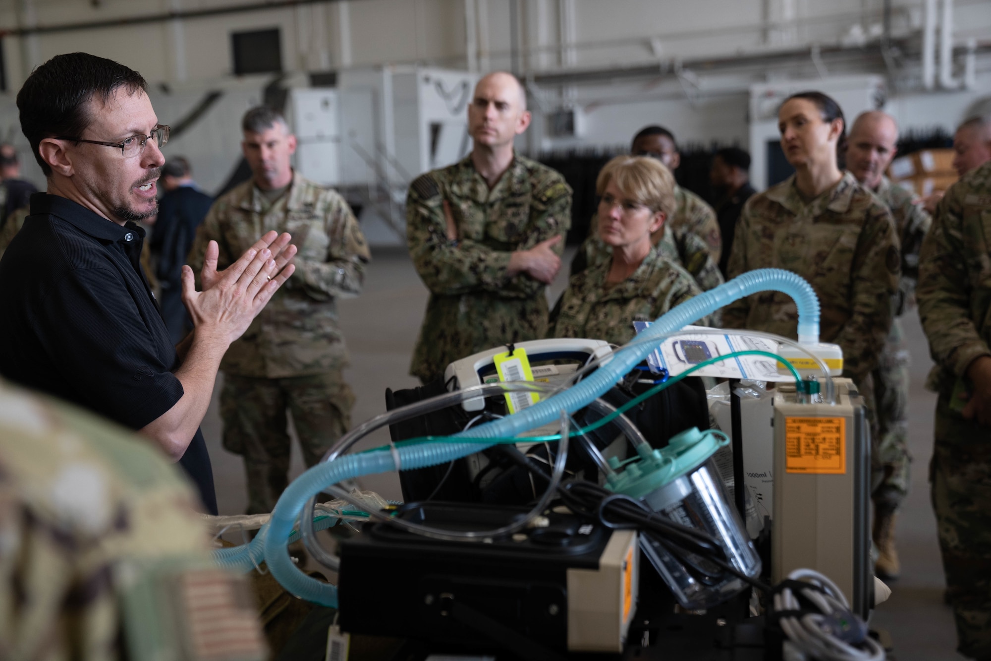 Senior leaders from the U.S. Navy, Air Force and Army listen to briefs from U.S. Transportation Command personnel about Exercise Ultimate Caduceus, March 3, 2022. The USTRANSCOM-led annual patient movement field training exercise is designed to simulate bringing injured troops from outside the continental U.S. to advanced care centers stateside. (U.S. Navy Photo by Mass Communication Specialist 1st Class David Kolmel)