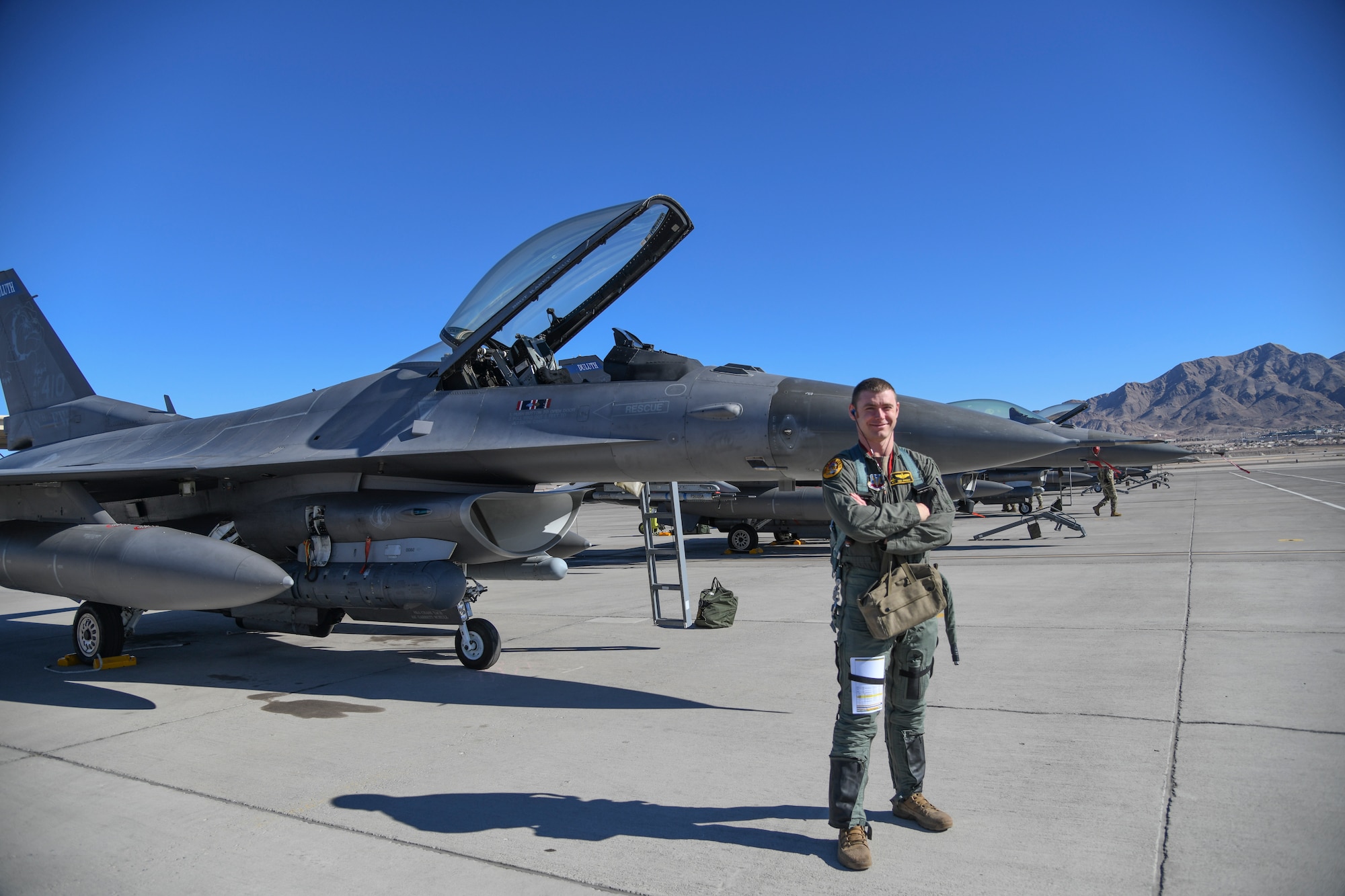 U.S. Air Force Maj. Jason Bright, F-16 pilot, 148th Fighter Wing, poses for a photo while participating in Red Flag 22-1. Bright was one of ten F-16 pilots to graduate from Weapons School in December 2021, held at the 37th Weapons Squadron, 57th Wing, Nellis Air Force Base, Nev.