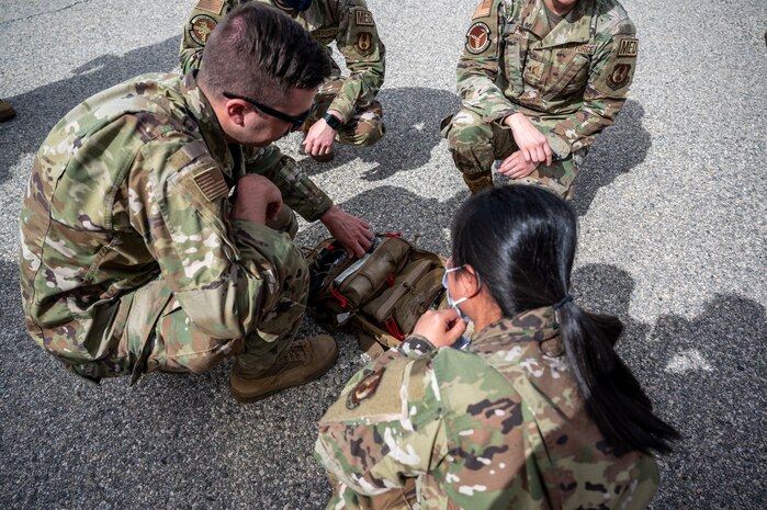 Soldiers from C Comapny, 2916th Aviation Battalion, 916th Support Brigade and Airmen from the 412th Medical Group, conduct medevac training at Edwards Air Force Base, California, March 3. (Air Force photo by Katherine Franco)