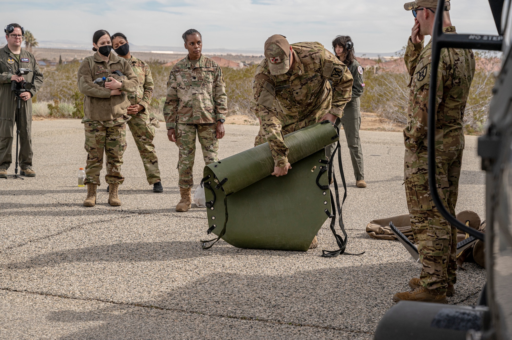 Soldiers from C Company, 2916th Aviation Battalion, 916th Support Brigade and Airmen from the 412th Medical Group, conduct medevac training at Edwards Air Force Base, California, March 3. (Air Force photo by Katherine Franco)