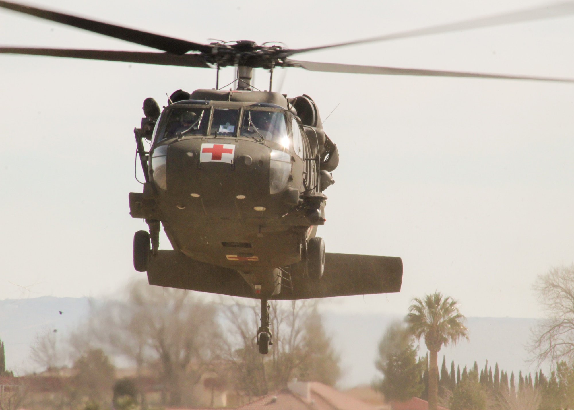 A UH-60 Blackhawk helicopter assigned to Charlie Company, 2916th Aviation Battalion, 916th Support Brigade, lands at Edwards Air Force Base, California, March 3. The Army unit trained with medical personnel from the 412th Medical Group on proper medevac procedures. (Air Force photo by Laura Maples)