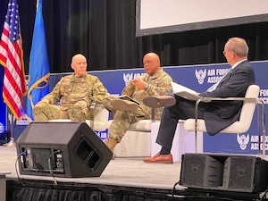 Lt. Gen. Thomas A. Bussiere, deputy commander of U.S. Strategic Command (left), Gen. Anthony Cotton, commander of Air Force Global Strike Command (center), and Lt. Gen. (Ret.) David Deptula, Dean of the Mitchell Institute for Aerospace Studies sit on stage during the 2022 Air Force Association Warfare Symposium, March 3 in Orlando, Florida. AFA’s Air Force Association Warfare Symposium is a premiere professional development event for the U.S. Air Force and U.S. Space Force, as well as the aerospace and defense industries that support them. (Air Force courtesy photo)