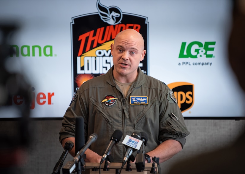Lt. Col. Josh Ketterer, a pilot in the Kentucky Air National Guard, discusses the lineup of military aircraft slated to perform in the 2022 Thunder Over Louisville air show during a press conference held in Louisville, Ky., March 3, 2022. The event will return to the banks of the Ohio River after a two-year absence and is expected to feature dozens of planes, including the U.S. Air Force F-22 Raptor Demo Team and a brand-new C-130J Super Hercules from the Kentucky Air Guard. This year’s show celebrates the 75th anniversary of the United States Air Force. (U.S. Air National Guard photo by Dale Greer)