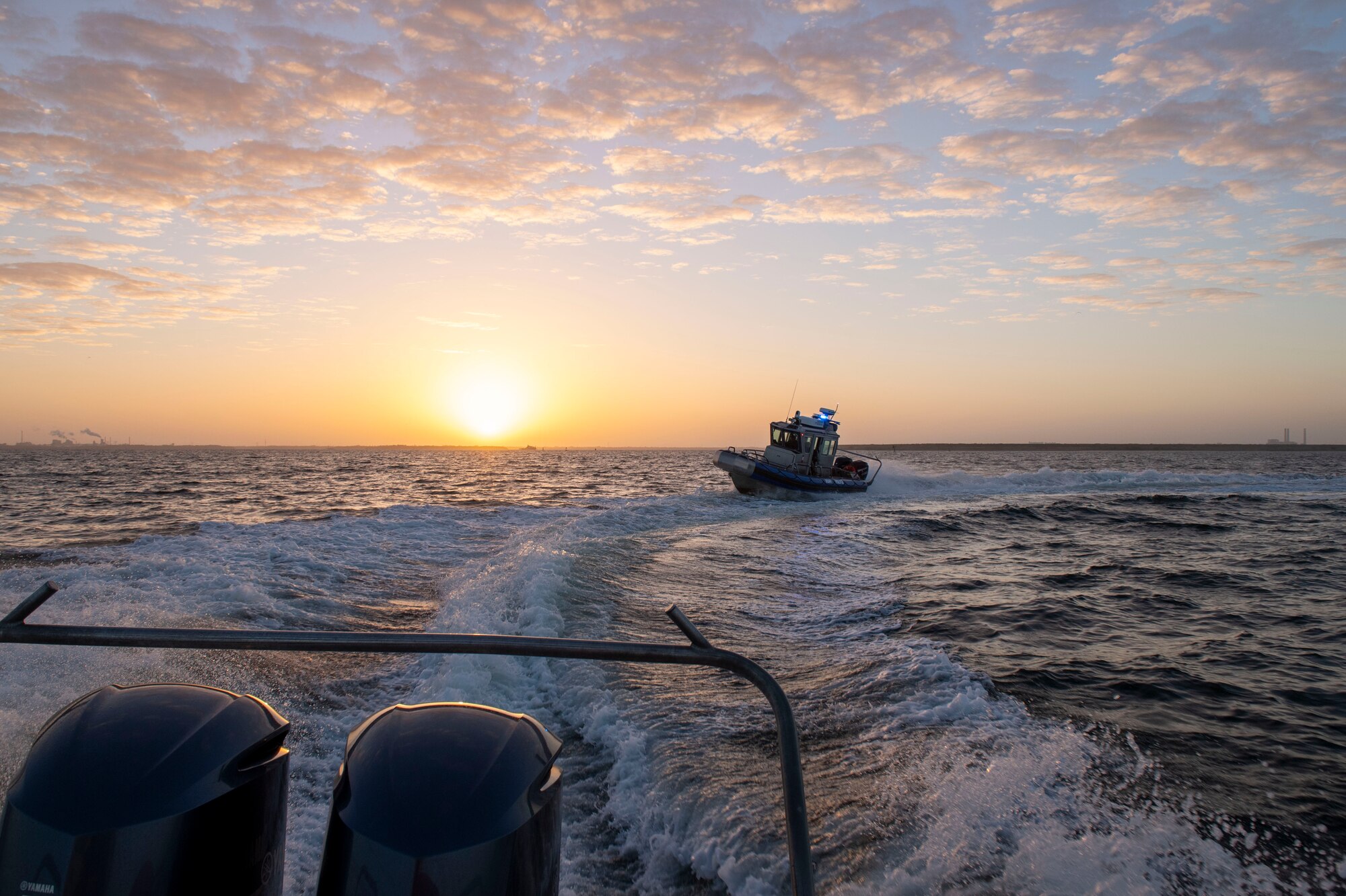 Two patrol boats assigned to the 6th Security Forces Squadron marine patrol unit simulate detaining an unauthorized vessel in Tampa Bay, Florida, March 7, 2022.