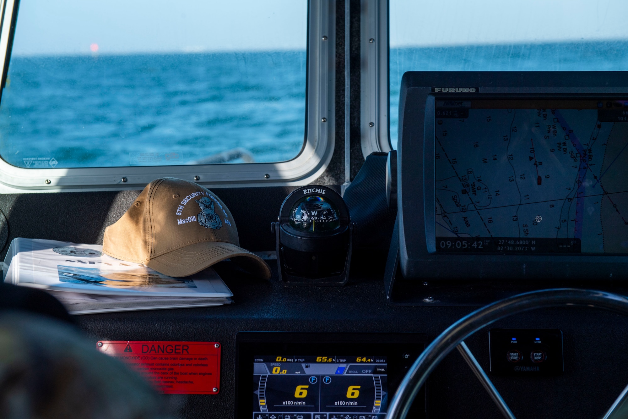 A 6th Security Forces Squadron marine patrol hat is shown on the dash of a marine patrol boat in Tampa Bay, Florida, March 7, 2022.