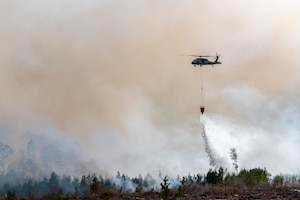 UH-60 Black Hawk and CH-47 Chinook helicopter crews from the Florida National Guard help battle wildfires in Bay County March 7, 2022. The Florida National Guard is working closely with state and local partners to contain the Chipola Complex fires across multiple counties in the Florida Panhandle.
