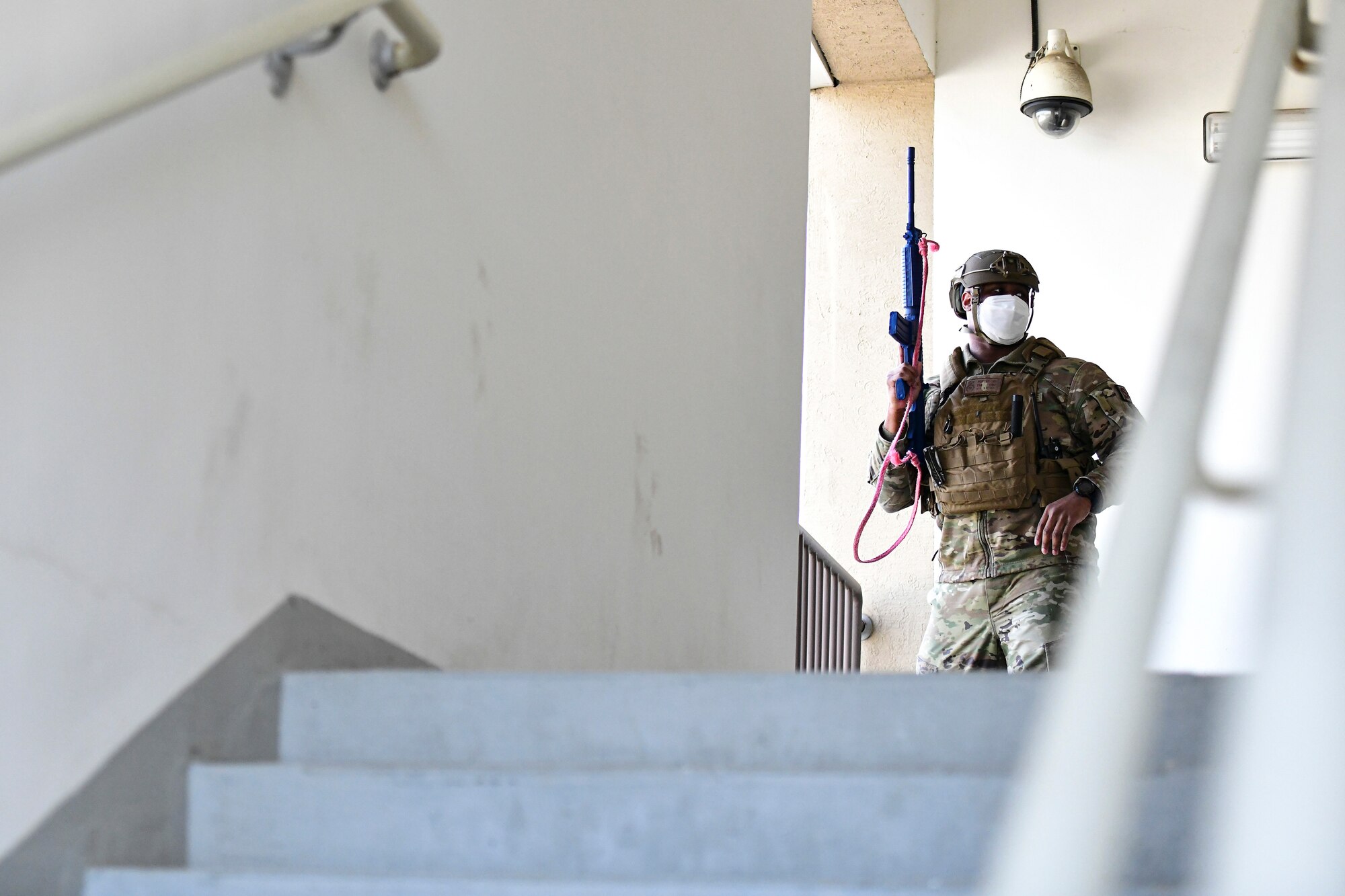 An Airman exits a building.
