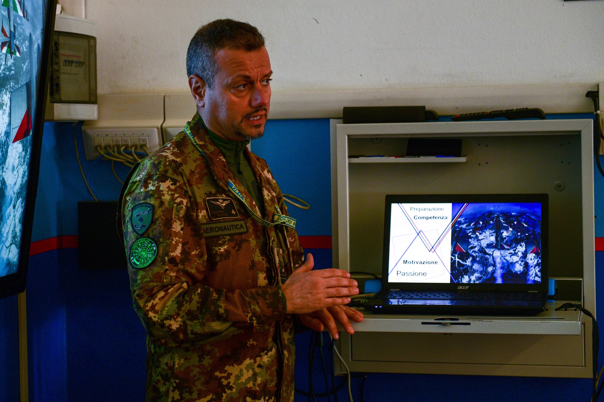 The Italian air force Air Traffic Control (ATC) Tower commander speaks to a group of aeronautical high school students at the Nobile Aviation college in Udine, Italy, March 8, 2022. This speaking engagement allowed the ITAF ATC commander to share facts about the ATC operations and controlling aircraft. (U.S. Air Force photo by Senior Airman Brooke Moeder)