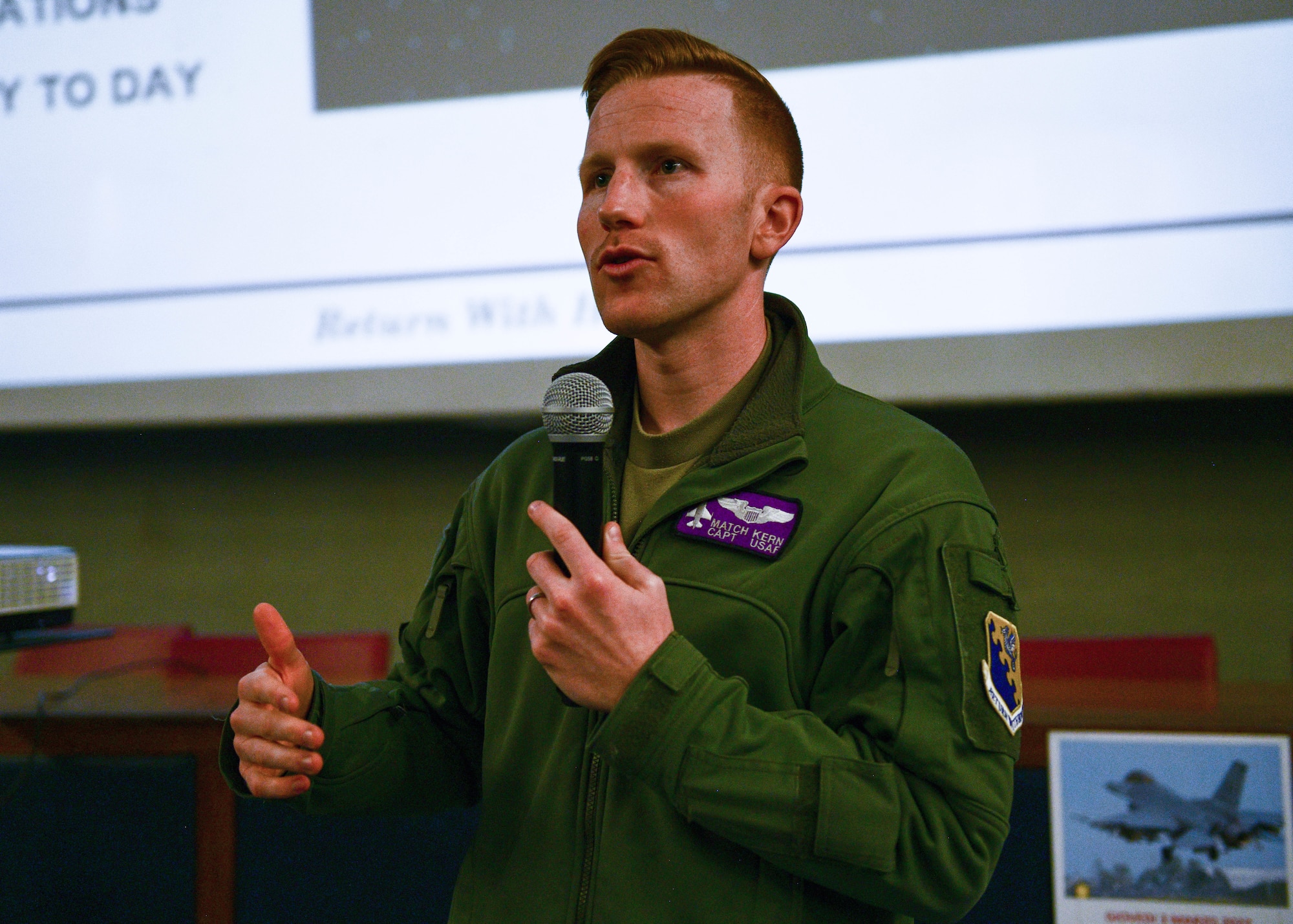 U.S. Air Force Capt. Ben Kern, 510th Fighter Squadron F-16 Fighting Falcon pilot, speaks to high school aeronautical students at the Malignani Aeronautical Institute in Udine, Italy, March 3, 2022. A pilot and maintainer from the 31st Fighter Wing and the Italian base commander spoke in front of approximately 60 aeronautical high school students and shared their experiences of being in the military. (U.S. Air Force photo by Senior Airman Brooke Moeder)