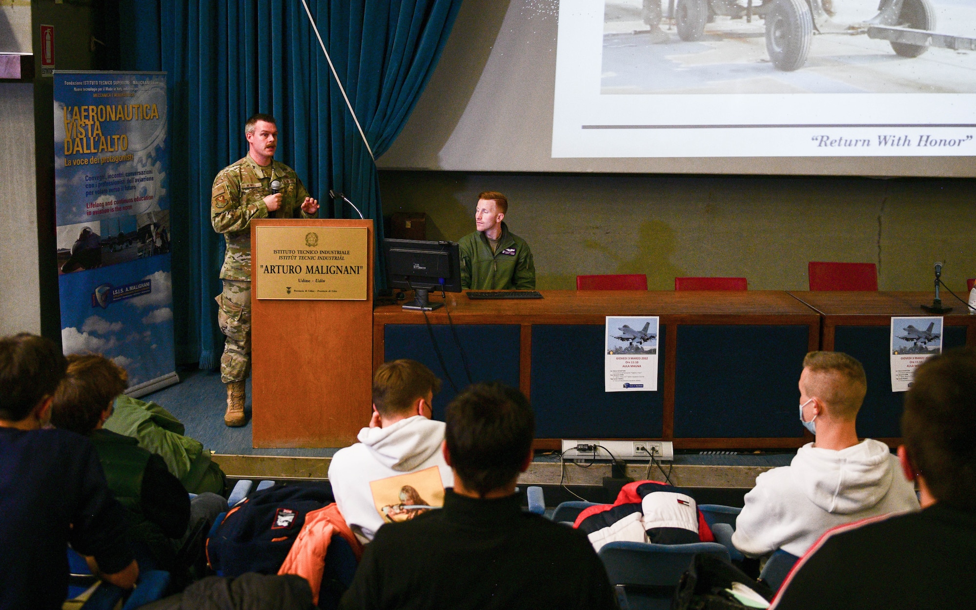 Tech. Sgt. Hunter Newell, 31st Maintenance Group Quality Assurance inspector, shares his maintenance experiences with approximately 60 high school aeronautical students at the Malignani Aeronautical Institute in Udine, Italy, March 3, 2022. Since the 1930s, the school has qualified more than 25,000 students and the school equips the students to be successful in the job field.(U.S. Air Force photo by Senior Airman Brooke Moeder)
