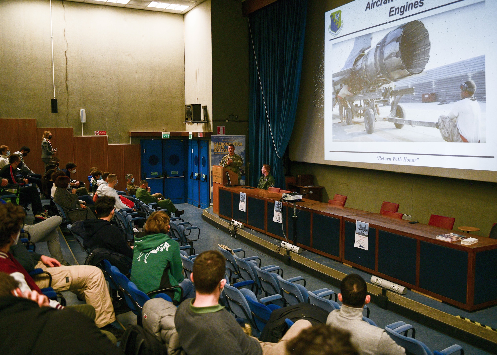 Tech. Sgt. Hunter Newell, 31st Maintenance Group Quality Assurance inspector, speaks to a group of aeronautical high school students at the Malignani Aeronautical Institute in Udine, Italy, March 3, 2022. A pilot and maintainer from the 31st Fighter Wing had the opportunity to share their career experiences with aeronautical high school students and engage with the future generation of pilots. (U.S. Air Force photo by Senior Airman Brooke Moeder)