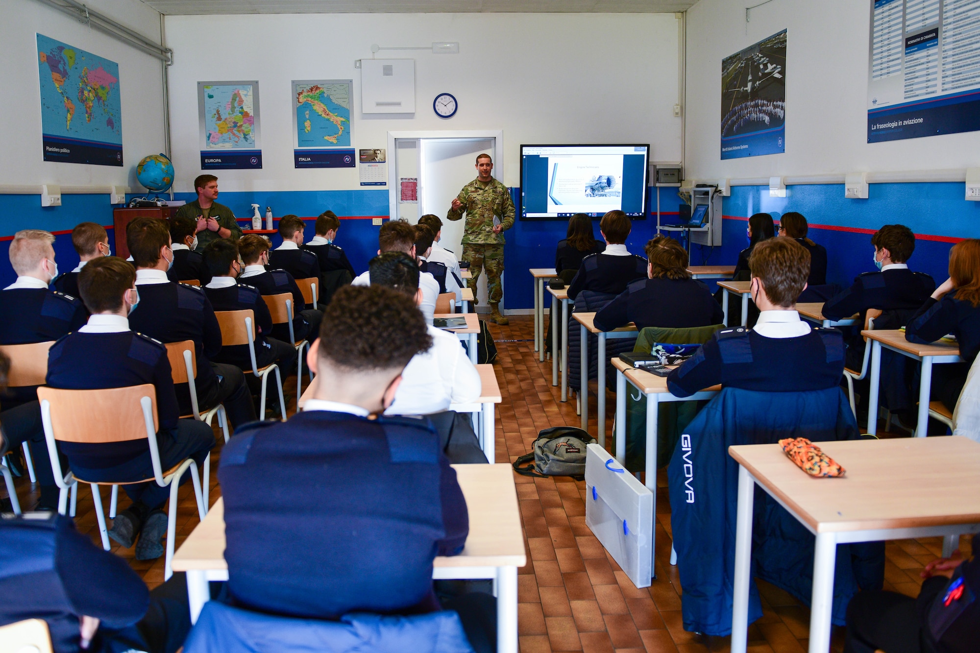 Tech. Sgt. Jacob Thompson, 31st Maintenance Group Quality Assurance inspector, shares his job experiences with high school aeronautical students at the Nobile Aviation college in Udine, Italy, March 8, 2022. There are approximately 90 students in the Nobile Aviation college and the pilots and maintainer spoke on their experiences in the military. (U.S. Air Force photo by Senior Airman Brooke Moeder)